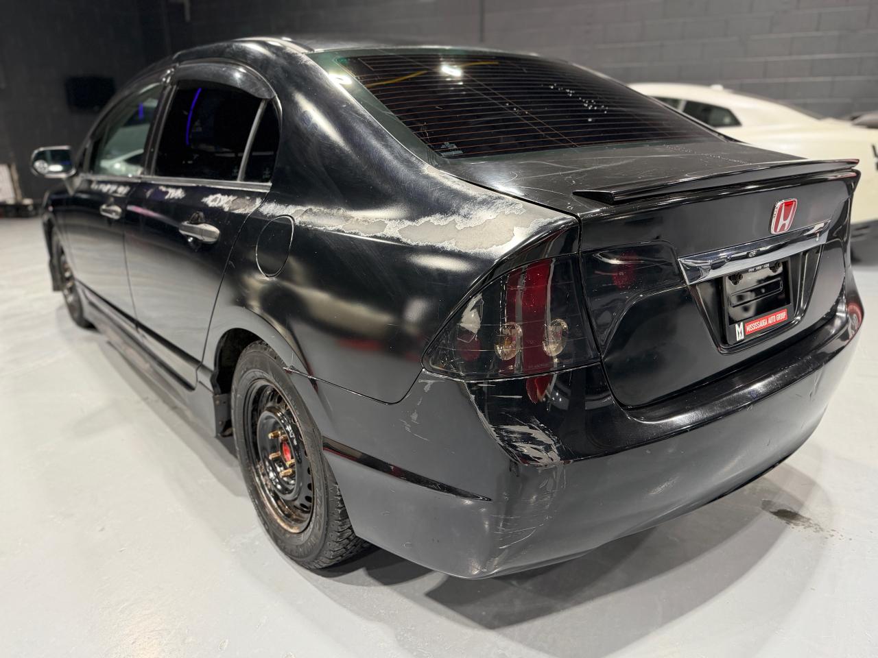 2010 Honda Civic 4dr Man DX-G Photo