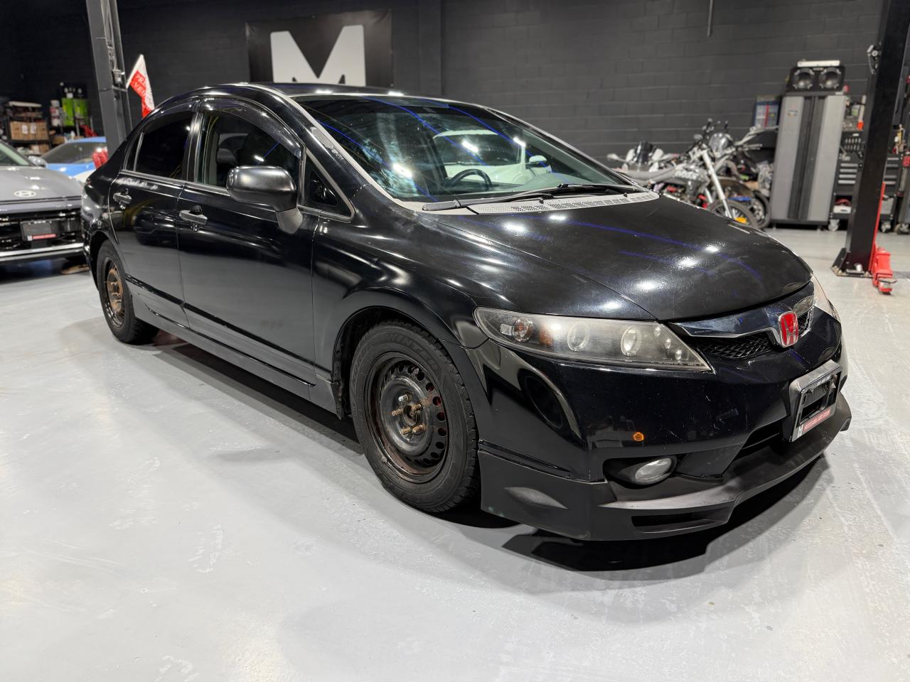 2010 Honda Civic 4dr Man DX-G Photo2
