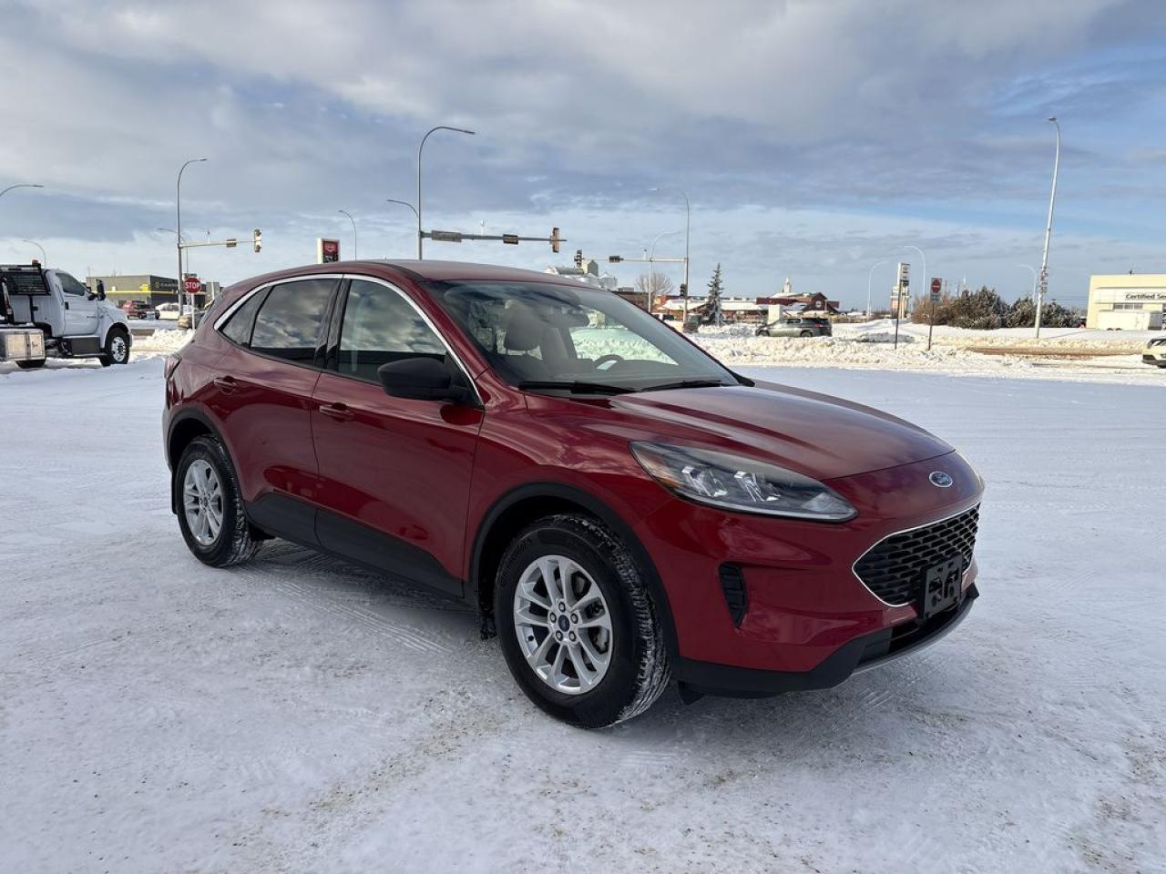 THE PRICE YOU SEE, PLUS GST. GUARANTEED!APPLE CARPLAY/ANDROID AUTO COMPATABLE! 1.5 LITER ECOBOOST, 8 SPEED AUTO, SE AWD TRIM(200a), DARK EARTH GREY CLOTH SEATS, COLD WEATHER PACKAGE, HEATED FRONT SEATS, HEATED STEERING WHEEL, REMOTE START SYSTEM, REAR PARKING SENSORS, FORD PASS CONNECT, INTELLEGENT ACCESS W/ PUSH BUTTON START.      The 2022 Ford Escape SE equipped with the 1.5-liter EcoBoost engine, an 8-speed automatic transmission, the 200A package, and SYNC 3 infotainment system offers a balanced combination of performance, technology, and comfort in a compact SUV. The 1.5-liter EcoBoost turbocharged three-cylinder engine delivers around 181 horsepower and 190 lb-ft of torque, providing responsive acceleration and impressive fuel efficiency, making it suitable for daily commuting and light off-road adventures. The 8-speed automatic transmission ensures smooth gear shifts and optimal performance across various driving conditions, enhancing both comfort and efficiency. The SE trim adds sporty styling cues and interior upgrades, including cloth or optional leather-trimmed seats, a well-designed interior layout, and user-friendly controls. The 200A package enhances the vehicle with advanced safety and convenience features, such as Ford Co-Pilot360 driver-assist technologies, a power liftgate, and upgraded interior materials. The SYNC 3 infotainment system features a responsive touchscreen interface, Apple CarPlay, Android Auto, and available navigation, providing seamless connectivity and entertainment options for occupants. Overall, this configuration makes the 2022 Ford Escape SE a versatile, tech-savvy, and comfortable choice for drivers seeking a reliable and stylish compact SUV.Do you want to know more about this vehicle, CALL, CLICK OR COME ON IN!*AMVIC Licensed Dealer; CarFax and Full Mechanical Inspection Included.