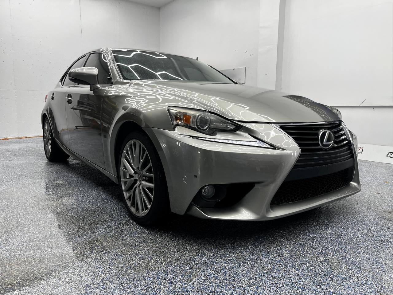 2014 Lexus IS 250 | AWD | Sedan | V6 | Certified Luxury<br/> <br/> Silver Exterior | Cream Leather Interior | All-Wheel Drive | Power Windows | Power Locks | Bluetooh <br/> <br/> <br/> Elegant, athletic, and refined  the 2014 Lexus IS 250 blends precision engineering with timeless design. With a smooth 2.5L V6 engine, luxurious cabin, and certified quality, this sedan is built to elevate every drive. <br/> <br/> <br/> Key Features: <br/> Sophisticated Style: The shimmering silver exterior pairs beautifully with the Cream leather interior, creating a clean and upscale aesthetic. Sleek lines, bold contours, and signature Lexus detailing give the IS 250 a poised and modern presence. <br/> <br/> <br/> Confident Performance: Powered by a 2.5L V6 engine and equipped with an automatic transmission, the IS 250 delivers smooth acceleration and responsive handling. All-Wheel Drive ensures stability and traction in all conditions  perfect for Canadian roads. <br/> <br/> <br/> Comfort & Craftsmanship: Inside, enjoy premium leather upholstery, ergonomic seating for five, and a thoughtfully designed cabin that prioritizes comfort. Dual-zone climate control and refined finishes make every journey a pleasure. <br/> <br/> <br/> Smart Functionality: From keyless entry to intuitive controls, the IS 250 offers convenience and connectivity. Whether commuting or cruising, this sedan keeps you in control with elegance. <br/> <br/> <br/> This Vehicle Has Travelled 167,669 Kms <br/> <br/> <br/> *** NO additional fees except for taxes and licensing! *** <br/> <br/> <br/> *** 100-point inspection on all our vehicles & always detailed inside and out *** <br/> <br/> <br/> RevMotors is at your service to ensure you find the right car for YOU. Even if we do not have it in our inventory, we are more than happy to find you the vehicle that you are looking for. Give us a call at 613-791-3000 or visit us online at www.revmotors.ca <br/> <br/> <br/> Ça nous donnera du plaisir de vous servir en Français aussi! <br/> <br/> <br/> CERTIFICATION * All our vehicles are sold Certified for the province of Ontario (Quebec Safety Available, additional charges may apply) <br/> FINANCING AVAILABLE * RevMotors offers competitive finance rates through many of the major banks. Should you feel like youve had credit issues in the past, we have various financing solutions to get you on the road. We accept No Credit - New Credit - Bad Credit - Bankruptcy - Students and more!! <br/> EXTENDED WARRANTY * For your peace of mind, if one of our used vehicles is no longer covered under the manufacturers warranty, RevMotors will provide you with a 6 month / 6000KMS Limited Powertrain Warranty. You always have the options to upgrade to more comprehensive coverage as well. Well be more than happy to review the options and chose the coverage thats right for you! <br/> TRADES * Do you have a Trade-in? We offer competitive trade in offers for your current vehicle! <br/> SHIPPING * We can ship anywhere across Canada. Give us a call for a quote and we will be happy to help! <br/> <br/> <br/> Buy with confidence knowing that we always have your best interests in mind! <br/>