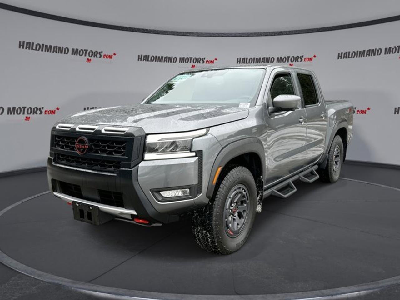 // ACCIDENT FREE!! //Meet the used 2025 Nissan Frontier PRO-4X Crew Cab 4x4 | 360 Camera | Sunroof | Heated Seats, now available at Haldimand Motors Ltd. in Cayuga. Finished in dark grey, this 4-door truck has just 10,361 km and pairs a 3.8 L gas engine with an automatic transmission.Built for real Canadian roads and weekend escapes, this 2025 Nissan Frontier PRO-4X Crew Cab 4x4 | 360 Camera | Sunroof | Heated Seats gives you confident 4WD traction, off-road tires, and a limited slip differential for added grip when conditions change. With a towing capacity of 3,030 kg, it is ready for trailers, toys, and work gear.FEATURES OF THE Frontier PRO-4X Crew Cab 4x4 | 360 Camera | Sunroof | Heated Seats   360 camera for confident tight parking    Power sunroof for open-air drives    Heated front seats for cold mornings    Four-wheel drive for year-round traction TRUCK FEATURES   Towing capacity rated at 3,030 kg    Rear tow hook for recovery help    Limited slip differential for added traction    Off-road tires for rougher terrain ADVANCED SAFETY FEATURES   Anti-lock braking system helps maintain control    Stability control supports confident handling    Blind spot monitor aids lane changes    Side impact airbags add occupant protection PERFORMANCE AND EFFICIENCY   3.8 L gas engine power    Automatic transmission for smooth shifting    Four-wheel drive for slippery conditions    Power steering for easier low-speed turns COMFORT AND CONVENIENCE   Heated front seats for winter comfort    Dual-zone automatic climate control included    Remote starter for pre-warmed cabin    Power windows with automatic door locks TECHNONOLGY AND CONNECTIVITY   Apple CarPlay and Android Auto    Bluetooth integration for hands-free calling    Satellite radio for more listening choice    WiFi hotspot helps keep devices connected CARGO SPACE   Crew Cab seating with rear access    Rear trunk access for easier loading    Spare tire carried for roadside readiness    Practical storage for daily work essentials WHAT OTHER OWNERS LIKE   Strong, smooth power from the V6    Confident 4WD feel in bad weather    Useful camera views for parking ease    Comfortable cabin layout and easy controls This 2025 Nissan Frontier PRO-4X Crew Cab 4x4 | 360 Camera | Sunroof | Heated Seatss VIN is: 1N6ED1EK6SN614743.Why Choose Us?Honest & Transparent Buying Experience: Weve been a trusted name in business since 1984.Straightforward Pricing: Our Advertised Price Includes:Safety Certification (No separate fee!)30-Day 100% Mechanical WarrantyFREE Carfax History Report.No upcharge for paying cash.(Prices Exclude HST and Licensing Fees only.)Browse 300+ vehicles all in ONE LOCATION.EASY FINANCING: Great rates & open loansWE BUY CARS: Get Top Dollar for your trade-in, or sell us your vehicle for CASH! Even if you dont buy from us!Stop By TodayTreat yourself - stop by Haldimand Motors Ltd. located at 42 Talbot St E, Cayuga, ON N0A 1E0 to make this car yours today! https://www.haldimandmotors.com/used/stock-451702.html