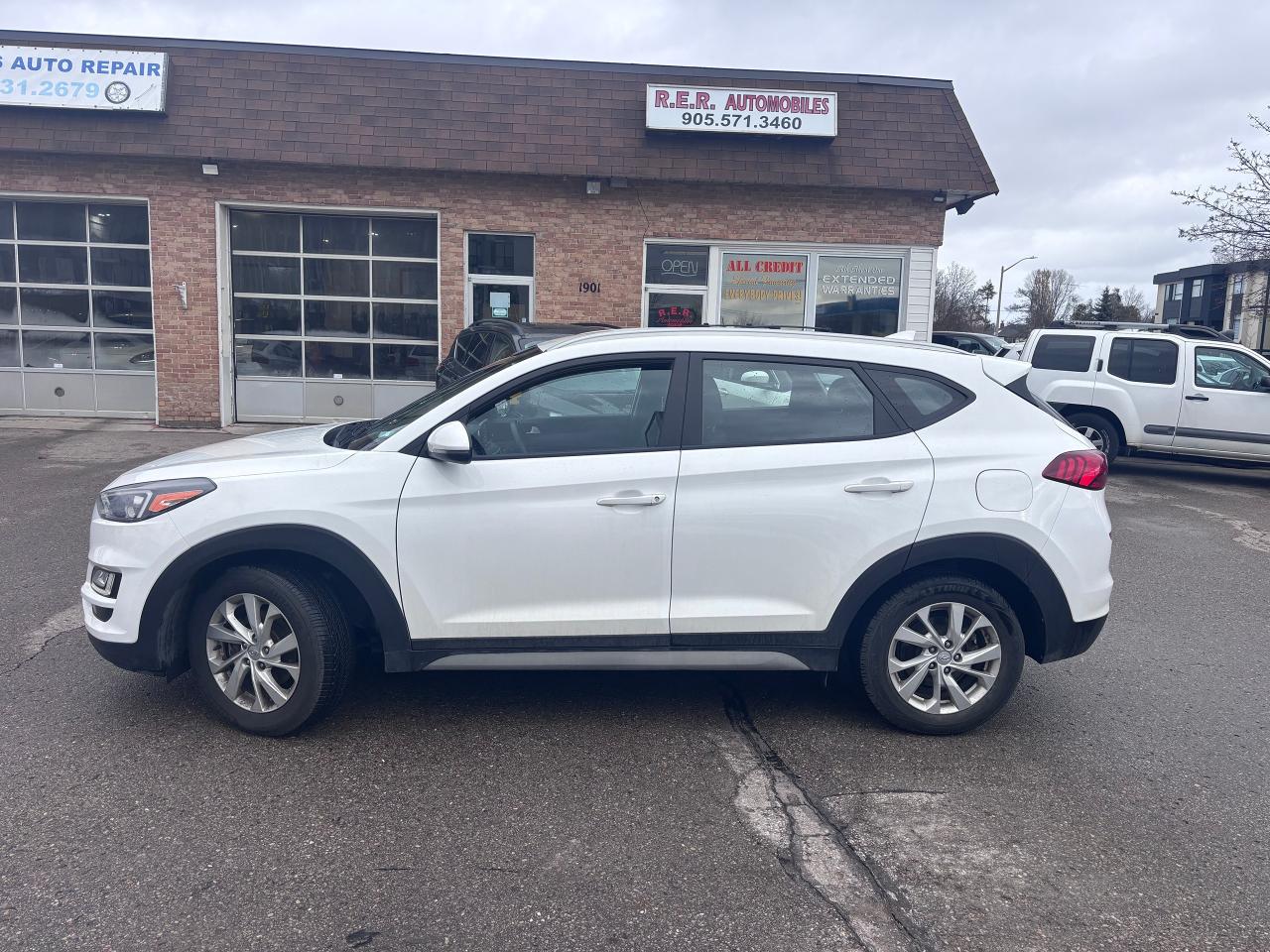 <p>Looking for a reliable and capable SUV? Check out this sharp 2019 Hyundai Tucson AWD, now available at R.E.R. Automobiles Ltd.! This sleek, white SUV with a black interior is ready to take on any adventure, offering a comfortable and confident driving experience. With 134,050 km on the odometer, this Tucson has plenty of life left and is eager to hit the road with you. Its fuel-efficient 4-cylinder engine and smooth automatic transmission make it an ideal choice for both city driving and weekend getaways.</p><p>This Tucson is loaded with features designed to enhance your driving experience. The All-Wheel Drive system ensures superior handling and control in various weather conditions, providing peace of mind year-round. Youll also appreciate the generous cargo space, making it easy to haul groceries, luggage, or sports equipment. The black interior offers a stylish and inviting cabin.</p><p>Here are five features youll love:</p><ul><li><strong>All-Wheel Drive:</strong> Conquer any road condition with confidence.</li><li><strong>Loaded with Features:</strong> Enjoy a comfortable and convenient ride.</li><li><strong>Fuel-Efficient Engine:</strong> Save money at the pump without sacrificing performance.</li><li><strong>Spacious Interior:</strong> Plenty of room for passengers and cargo.</li><li><strong>Stylish Design:</strong> Make a statement wherever you go.</li></ul><p><strong><em>Powered by AutoIntelligence&trade;</em></strong> Vehicle information has been generated using artificial intelligence and is provided for informational purposes only. While efforts are made to ensure accuracy, please confirm all details directly with the dealer.</p><pre style=overflow-wrap: break-word; white-space: pre-wrap;>This vehicle is certified,  serviced & oil changed. Financing available O.A.C  <br><br><br>R.E.R. Automobiles Ltd. is a family owned business, established in 1994.<br><br>Referrals built us, reliability keep us serving you.<br><br>R.E.R. Automobiles Ltd. ... We Care.</pre>