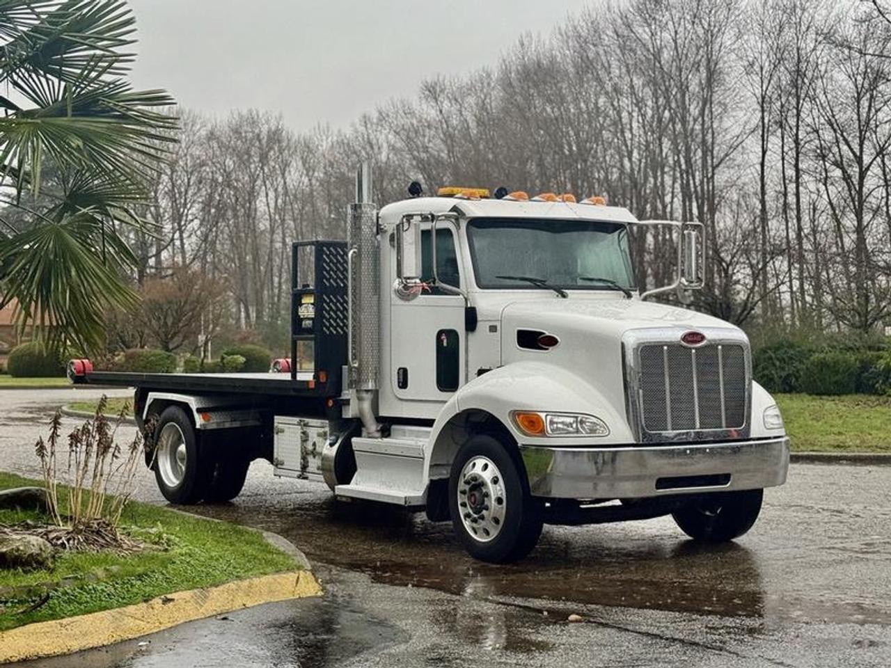 The 2020 Peterbilt 330 Hook Truck is a medium-duty commercial unit equipped with a 16-foot roll-off flat deck and rated for 12,000 lb capacity, making it well suited for waste, recycling, equipment transport, and roll-off container operations. Powered by a 6.7L PX-7 diesel engine paired with an automatic transmission and 4x2 drivetrain, this truck features hydraulic brakes, PTO, regen switch, and auto idle shutdown for efficient fleet operation. Additional equipment includes air suspension switch, air-assisted driver seat, air horn, beacon, heated mirrors, storage compartments, and 12V power inputs. The cab is fitted with air conditioning and heat, cruise control, AM/FM radio, and power windows and door locks. Finished in white with a grey cloth interior, the deck measures approximately 16 ft long and 8 ft 5 in wide, while overall dimensions are approximately 26 ft 8 in long, 8 ft 6 in wide, and 9 ft 10 in high, offering a durable and practical roll-off hook truck platform. This item is currently OFFSITE. You must register an appointment with our office to schedule an offsite viewing. Appointments must be made a minimum of one business day in advance (and as defined by the days that Repo.com is open for business) before your appointment can be scheduled and confirmed. We may, at our own discretion, instead opt to transport smaller items to Repo.coms main yard for viewing purposes.  $135,850.00 plus $375 processing fee, $136,225.00 total payment obligation before taxes.  Listing report, warranty, contract commitment cancellation fee, financing available on approved credit (some limitations and exceptions may apply). All above specifications and information is considered to be accurate but is not guaranteed and no opinion or advice is given as to whether this item should be purchased. We do not allow test drives due to theft, fraud, acts of vandalism and undetectable impaired driving. Instead we provide the following benefits: Complimentary Warranty (with options to extend), Limited Money Back Satisfaction Guarantee on Fully Completed Contracts, Contract Commitment Cancellation, and an Open-Ended Sell-Back Option. Ask seller for details or call 604-522-REPO(7376) to confirm listing availability.