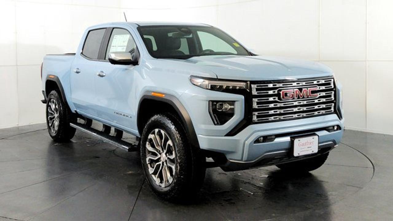 The 2026 GMC Canyon Denali blends upscale comfort with rugged capability, featuring a high-torque 310-hp TurboMax engine alongside a 2-inch factory lift and ultra-wide stance for confident off-road and trailering performance, boasting a towing capacity of up to 7,700 lbs. Its refined interior showcases Denali-exclusive Jet-Black leather-appointed seats with teak wood accents, a first-in-class 6.3-inch multicolor head-up display, a sunroof and a Bose premium audio system complemented by an 11.3-inch center touchscreen and HD Surround Vision with up to 10-camera views. Outside, the truck distinguishes itself with a sculpted chrome grille, exclusive 20-inch diamond-cut aluminum wheels, chrome assist steps, sunroof and a MultiStow tailgate offering integrated storage with a drain, perfectly balancing style and utility.