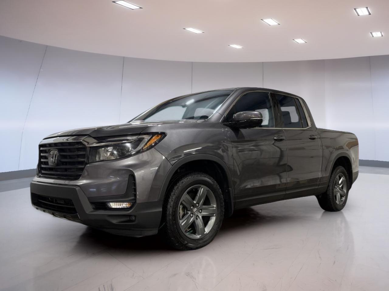 Discover the versatility and capability of the 2023 Honda Ridgeline Touring, now available at Moose Jaw Honda in Moose Jaw. This used pickup stands out with its Grey exterior and Black interior, offering a refined yet rugged look. With only 42,556 km on the odometer, its ready for many more adventures. The 9-speed automatic transmission and advanced all-wheel drive system ensure confident handling in all conditions.

TRUCK FEATURES
»» All-wheel drive for enhanced off-road capability
»» 3.5L V6 engine with direct injection power
»» 9-speed automatic transmission for smooth shifting
»» Impressive towing and payload capacity

ADVANCED SAFETY FEATURES
»» Side impact airbags for added protection
»» Backup camera for safer reversing
»» Traction control for improved stability
»» Anti-lock braking system for secure stops

PERFORMANCE AND EFFICIENCY
»» 3.5L SOHC i-VTEC V6 engine
»» Direct injection for better fuel efficiency
»» Grade logic control for optimized gear shifts
»» All-wheel drive traction for all weather

COMFORT AND CONVENIENCE
»» Spacious cabin for comfortable journeys
»» Dual-zone climate control for personalized comfort
»» Power-adjustable drivers seat for easy positioning
»» Ample legroom for all passengers

TECHNOLOGY AND CONNECTIVITY
»» Touchscreen display for easy controls
»» Bluetooth hands-free calling and audio
»» USB ports for device charging
»» Premium sound system for enhanced audio

CARGO SPACE
»» Large bed for hauling gear and supplies
»» In-bed trunk for secure storage
»» Versatile rear seats for extra cargo room
»» Easy-lift tailgate for simple loading

WHAT OTHER OWNERS LIKE
»» Smooth ride quality on and off road
»» Practical in-bed trunk storage solution
»» User-friendly technology and controls
»» Comfortable and spacious interior

This 2023 Honda Ridgeline Tourings VIN is: 5FPYK3F70PB501797.