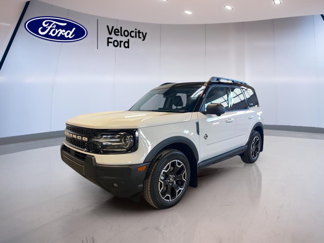 Discover the adventure-ready 2025 Ford Bronco Sport Outer Banks 4x4, now available brand new at Velocity Ford in Moose Jaw. This SUV showcases a modern white exterior paired with a sleek black interior, delivering both style and comfort. With four doors and an efficient 1.5-litre gas engine, its built for Canadian roads and all seasons.

FEATURES OF THE Bronco Sport Outer Banks 4x4  
»» Remote starter for added convenience year-round  
»» Heated mirrors for clear visibility in winter  
»» Dual-zone climate control for personalized comfort  
»» Ambient lighting package enhances cabin atmosphere  

ADVANCED SAFETY FEATURES  
»» Anti-lock braking system (ABS) for confident stops  
»» Blind spot monitor increases lane-change safety  
»» Lane departure warning helps prevent unintentional drifting  
»» Multiple airbags, including side impact and head  

PERFORMANCE AND EFFICIENCY  
»» 1.5-litre gas engine balances power and economy  
»» Four-wheel drive (4WD) for all-terrain capability  
»» 8-speed automatic transmission ensures smooth shifting  
»» Tire pressure monitoring for optimal performance  

COMFORT AND CONVENIENCE  
»» Heated front seats for cold Canadian mornings  
»» Memory seats and mirrors for personalized settings  
»» Power steering and adjustable wheel for easy handling  
»» Dual-zone automatic climate control boosts comfort  

TECHNONOLGY AND CONNECTIVITY  
»» Bluetooth integration for hands-free communication  
»» Satellite radio for endless entertainment options  
»» Steering wheel audio controls for easy access  
»» Push button start for modern convenience  

CARGO SPACE  
»» Rear trunk access for easy loading  
»» Foldable rear seats for versatile storage  
»» Ample space for luggage and gear  
»» Tinted windows protect cargo from sunlight  

WHAT OTHER OWNERS LIKE  
»» Confident all-weather capability with 4WD  
»» Intuitive technology and user-friendly controls  
»» Comfortable and quiet ride on highways  
»» Practical cargo solutions for daily needs  

This 2025 Ford Bronco Sport Outer Banks 4x4s VIN is: 3FMCR9CN4SRF64781.