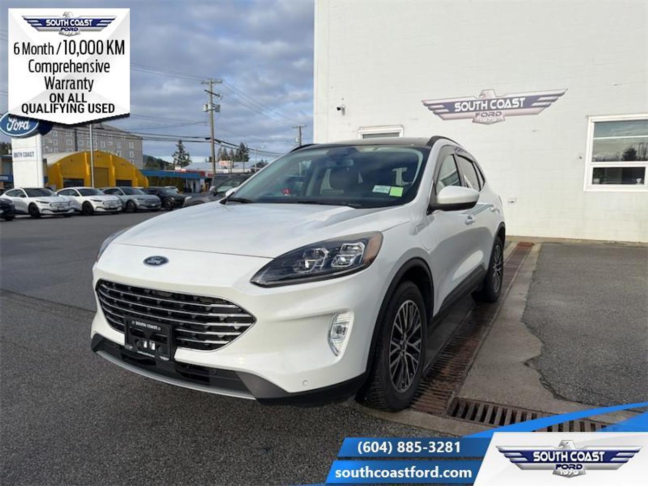 <b>Low Mileage, Sunroof, Heated Seats!</b><br> <br> <p style=color:Blue;><b>Upgrade your ride at South Coast Ford with peace of mind! Our used vehicles come with a minimum of 10,000 km and 6 months of Comprehensive Vehicle Warranty. Drive with confidence knowing your investment is protected.</b></p><br> <br> Compare at $30990 - Our Price is just $30304! <br> <br>With an interior that easily adapts to your needs and keeps all your equipment hidden, the Ford Escape is the perfect partner for the spontaneous adventurer. This 2022 Ford Escape is for sale today in Sechelt. <br> <br>The Ford Escape was built for an active lifestyle and offers plenty of options for you to hit the road in your own individual style. Whether you need a family SUV for soccer practice, a capable adventure vehicle, or both, the versatile Ford Escape has you covered. Built for those who live on the go, the Ford Escape was made to be unstoppable. This low mileage SUV has just 25,722 km. Its Star White Metallic Tri-Coat in colour and is completely accident free based on the <a href=https://vhr.carfax.ca/?id=kuNZu8zeESBFVyk/kgsCoEk3i3su9SiH target=_blank>CARFAX Report</a>. It has an Automatic transmission and is powered by a 2.5L 4 Cylinder Engine. It may have some remaining factory warranty, please check with dealer for details. <br> <br> Our Escapes trim level is Titanium Plug-In Hybrid. Stepping up to this premium Ford Escape Titanium Hybrid is a great choice as it comes fully loaded with heated sport contour premium seats that are powered in the front, exclusive aluminum wheels and Fords SYNC 3 infotainment system complete with a large touchscreen, integrated navigation, Apple CarPlay and Android Auto. Additional features include a power rear liftgate, heated leatherette steering wheel, SiriusXM radio paired with a premium Bang and Olufsen audio system, FordPass Connect 4G LTE, automatic climate control, a smart device remote starter plus unique exterior accents. For added convenience and safety this Ford Escape also comes with active park assist, Ford Co-Pilot360 that features lane keep assist, active park assist, blind spot detection, automatic emergency braking with evasion assist and cross traffic alert plus so much more. This vehicle has been upgraded with the following features: Sunroof, Heated Seats.<br> To view the original window sticker for this vehicle view this <a href=http://www.windowsticker.forddirect.com/windowsticker.pdf?vin=1FMCU0LZ4NUA41030 target=_blank>http://www.windowsticker.forddirect.com/windowsticker.pdf?vin=1FMCU0LZ4NUA41030</a>. <br/><br> <br>To apply right now for financing use this link: <a href=https://www.southcoastford.com/financing/ target=_blank>https://www.southcoastford.com/financing/</a><br><br> <br/><br> Buy this vehicle now for the lowest bi-weekly payment of <b>$249.34</b> with $0 down for 84 months @ 7.99% APR O.A.C. (All rates are OAC. Check with our team for rate specials on new and used vehicles. Banks will have financed minimum amounts for certain rates.     / Total Obligation of $41660  ).  See dealer for details. <br> <br>Call South Coast Ford Sales or come visit us in person. Were convenient to Sechelt, BC and located at 5606 Wharf Avenue. and look forward to helping you with your automotive needs.<br><br> Come by and check out our fleet of 20+ used cars and trucks and 80+ new cars and trucks for sale in Sechelt.  o~o