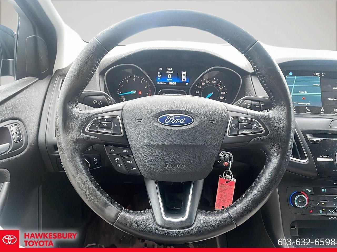 2017 Ford Focus SEL alloy wheels, a power moonroof, a rear-view ca Photo