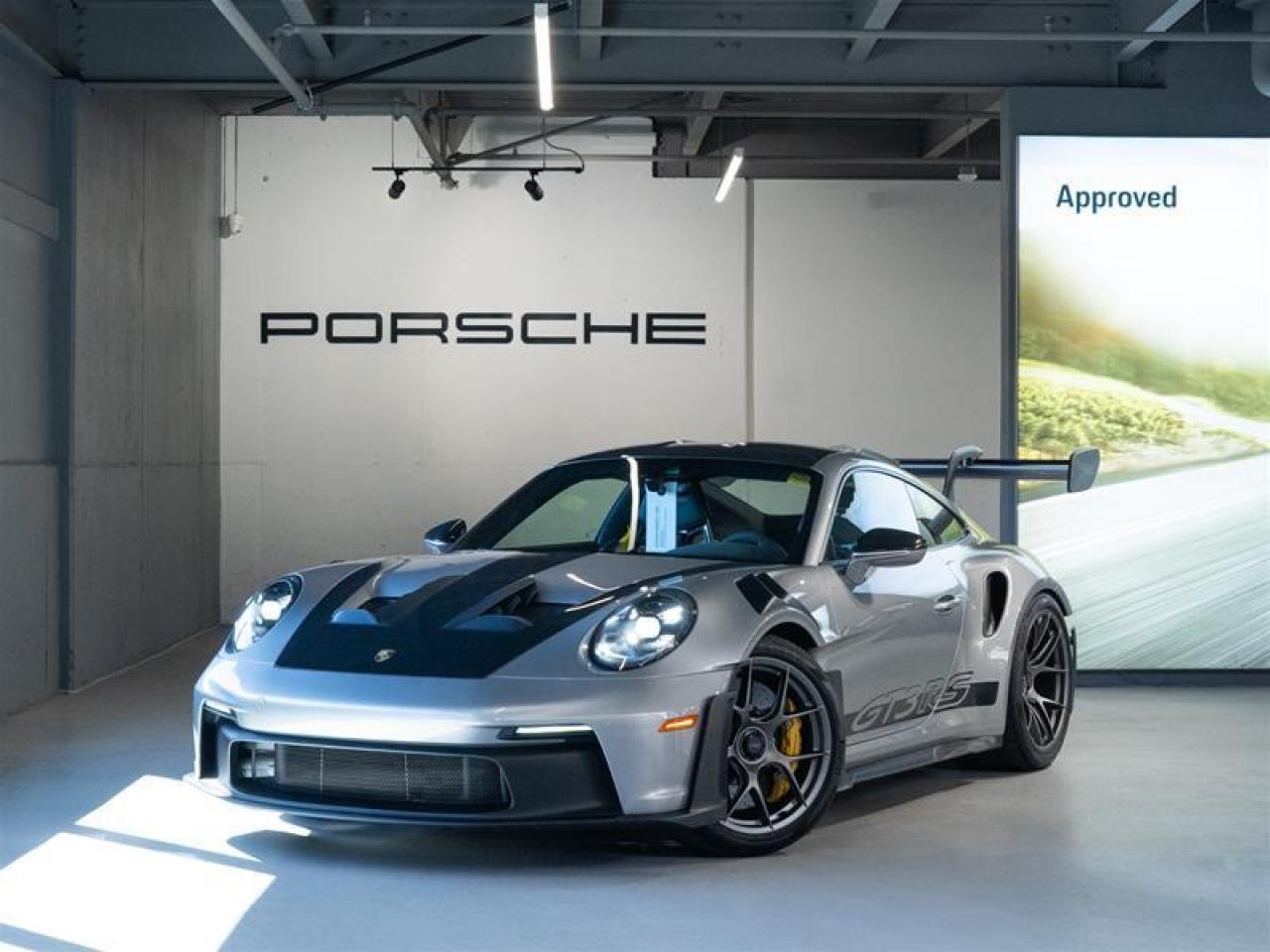 ***Leasing Options Available on Certified Pre-Owned Porsches*** The Porsche that you’ve always wanted. This 2024 911 GT3 RS (over $81,000 of options) has a Clean CarFax Report. With Leather/Race-Tex Interior in Black with GT Silver Stitching i.c.w. Weissach Package ($5,400), GT Silver Metallic ($4,820), Weissach Package ($38,250), Under Door Puddle Light Projectors ($190), Weissach RS Logo on Rear Wing Endplates ($520), Front Axle Lift System ($4,180), Porsche Ceramic Composite Brakes (PCCB) with Calipers in Yellow ($10,510), Extended Range Fuel Tank (23.7 gal.) ($260), Wheels Painted in Satin Dark Silver ($690), 20/21 GT3 RS Forged Lightweight Magnesium Wheels, Deviated Stitching Interior Package ($4,160), Seat Belts in Racing Yellow ($410), Extended Race-Tex Package ($1,560), Door Pull Loops in Black, Door-Sill Guards in Matte Carbon Fiber, Illuminated ($600), Sun Visors in Race-Tex ($680), Seat Belt Outlet Trims in Race-Tex ($630), BOSE® Surround Sound System ($1,820), Deletion of SiriusXM® Antenna, Dashboard with Deviated Stitching, Rear Side Panel with Deviated Stitching (Coupe Only), Center Console Lid with Deviated Stitching, Knee Pad with Deviated Stitching, Door Panel with Deviated Stitching, Color Selection for Stitching in Deviated Color, LED-Matrix Design Headlights in Black incl. Porsche Dynamic Light System Plus (PDLS+) ($4,580), Exclusive Design Taillights ($1,130), ParkAssist (Rear) ($700), Preparation for Porsche Dashcam (Front and Rear) ($150), and Ambient Lighting ($660), this is the car for you! Look for the Porsche Approved seal when buying a pre-owned Porsche. Porsche Approved Pre-Owned Cars are inspected in compliance with our 111-point checklist and any work required is performed using only 100% Porsche Genuine Parts. As proof of the trust that we have in the quality of our vehicles, every certified pre-owned car comes with a minimum of 24 months Porsche Approved Warranty and Porsche Roadside Assistance. The Porsche Approved Warranty covers all components of your Porsche and offers the same level of security as our new car warranty. Luxury Tax is not charged on Certified Pre-Owned vehicles. Call us at 613-749-4275 and ask to speak to one our Porsche Brand Executives. Serving the Ottawa & Gatineau region. *** Options de location disponibles pour les Porsche doccasion certifiées *** La Porsche de vos rêves. Cette voiture 2024 911 GT3 RS plus de 81, 000 $ doptions a un bon rapport d’historique de véhicule de CarFax. Grâce à Leather/Race-Tex Interior in Black with GT Silver Stitching i.c.w. Weissach Package ($5,400), GT Silver Metallic ($4,820), Weissach Package ($38,250), Under Door Puddle Light Projectors ($190), Weissach RS Logo on Rear Wing Endplates ($520), Front Axle Lift System ($4,180), Porsche Ceramic Composite Brakes (PCCB) with Calipers in Yellow ($10,510), Extended Range Fuel Tank (23.7 gal.) ($260), Wheels Painted in Satin Dark Silver ($690), 20/21 GT3 RS Forged Lightweight Magnesium Wheels, Deviated Stitching Interior Package ($4,160), Seat Belts in Racing Yellow ($410), Extended Race-Tex Package ($1,560), Door Pull Loops in Black, Door-Sill Guards in Matte Carbon Fiber, Illuminated ($600), Sun Visors in Race-Tex ($680), Seat Belt Outlet Trims in Race-Tex ($630), BOSE® Surround Sound System ($1,820), Deletion of SiriusXM® Antenna, Dashboard with Deviated Stitching, Rear Side Panel with Deviated Stitching (Coupe Only), Center Console Lid with Deviated Stitching, Knee Pad with Deviated Stitching, Door Panel with Deviated Stitching, Color Selection for Stitching in Deviated Color, LED-Matrix Design Headlights in Black incl. Porsche Dynamic Light System Plus (PDLS+) ($4,580), Exclusive Design Taillights ($1,130), ParkAssist (Rear) ($700), Preparation for Porsche Dashcam (Front and Rear) ($150), and Ambient Lighting ($660), cette voiture est parfaite pour vous! Trouvez le sceau d’approbation de Porsche lorsque vous achetez une Porsche d’occasion. Les voitures d’occasion approuvées par Porsche sont inspectées conformément à notre liste de vérification de 111 points. Tout travail requis est effectué en utilisant uniquement des pièces d’origine Porsche. Comme preuve de la confiance que nous avons dans la qualité de nos véhicules, chaque voiture d’occasion certifiée fait l’objet d’une garantie d’au moins 24 mois approuvée par Porsche et de l’assistance routière Porsche. La garantie approuvée par Porsche couvre tous les composants de votre Porsche et offre le même niveau de sécurité que notre garantie pour les véhicules neufs. La taxe de luxe n’est pas appliquée aux véhicules d’occasion certifiés. Appelez-nous au 613-749-4275 pour parler à l’un de nos directeurs de marque Porsche. Au service de la région d’Ottawa et du Gatineau.