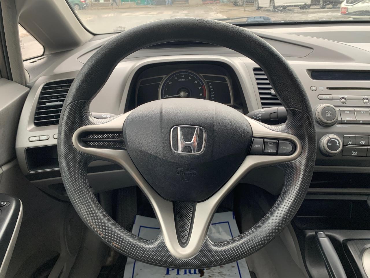 2011 Honda Civic 4dr Auto DX-G Photo