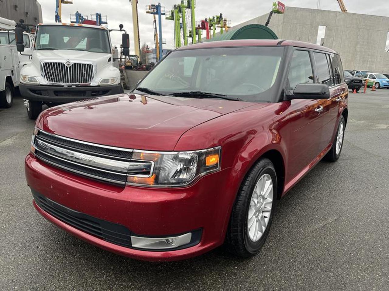 2015 Ford Flex SEL FWD powered by a 3.5L V6 engine with an automatic transmission and front-wheel drive. This used Ford Flex is finished in red with a black leather interior and offers a spacious, box-style SUV layout known for passenger comfort and cargo versatility.

The SEL trim includes leather seating, a power sunroof, power windows, power mirrors, air conditioning, cruise control, AM/FM audio, and 4-wheel ABS. With 136,357 km, this 2015 Ford Flex is available now and includes a detailed listing report, complimentary vehicle history report, limited money back satisfaction guarantee, and a 30-day powertrain warranty.  $13,710.00 plus $375 processing fee, $14,085.00 total payment obligation before taxes.  Listing report, warranty, contract commitment cancellation fee, financing available on approved credit (some limitations and exceptions may apply). All above specifications and information is considered to be accurate but is not guaranteed and no opinion or advice is given as to whether this item should be purchased. We do not allow test drives due to theft, fraud, acts of vandalism and undetectable impaired driving. Instead we provide the following benefits: Complimentary Warranty (with options to extend), Limited Money Back Satisfaction Guarantee on Fully Completed Contracts, Contract Commitment Cancellation, and an Open-Ended Sell-Back Option. Ask seller for details or call 604-522-REPO(7376) to confirm listing availability.