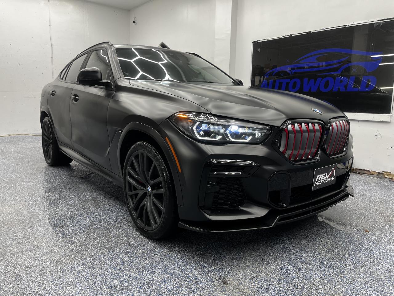 2022 BMW X6 xDrive40i | M-Sport | Black Vermilion Edition | Moonroof | Keyless Entry | AWD<br/> <br/> Frozen Black BMW Indicidual Exterior Paint Finish (L0U91) | Premium Enhanced Package | Adaptive M Suspension | M-Sport Brakes w/ Red Calipers | M-Sport Exhaust | Alcantara Roofliner | Parking Assistant with SUrround View | 22 Inch Alloy Wheels | Red BMW Kidney Grille Bars | Individual Shadowline Headlights | Adaptive Suspension | Performance Brakes | Keyless Entry | Full Merino Black Leather with Red Piping | Panoramic Moonroof | Navigation System | Harman Kardon® Surround Sound | Dual-Zone Climate Control | Heated front & Rear Seats | Ambient Interior Lighting | Active Protection | Driving Assistant | Active Guard | Head-Up Display | M-Aerodynamics Package | BMW Gesture Control | Paddle Shifters | 8-Speed Sport Automatic Transmission | xDrive Intelligent All-Wheel Drive | Dynamic Performance | Remote Start | and More <br/> <br/> <br/> Key Features: <br/> <br/> <br/> Commanding Presence: <br/> The Black exterior paired with a Black leather interior creates a bold, sophisticated look. With its coupe-inspired silhouette, sculpted body lines, and signature BMW kidney grille, the X6 xDrive40i stands out with a powerful road presence. <br/> <br/> <br/> Engineered to Perform: <br/> Powered by a turbocharged 3.0L inline-6 engine producing 335 horsepower, the X6 delivers smooth yet exhilarating acceleration. The 8-speed sport automatic transmission and BMWs xDrive all-wheel drive system ensure confident handling in all conditions. <br/> <br/> <br/> Luxury Meets Innovation: <br/> Inside, the cabin is finished with premium leather and modern detailing. Heated sport seats, dual-zone climate control, and a panoramic moonroof create a refined atmosphere, while paddle shifters and a driver-focused cockpit emphasize performance. <br/> <br/> <br/> Smart Connectivity: <br/> Equipped with BMWs iDrive infotainment system, navigation, and Harman Kardon® surround sound, the X6 offers intuitive control and immersive audio. Smartphone integration ensures seamless connectivity for every journey. <br/> <br/> <br/> Confidence and Control: <br/> Adaptive suspension, performance brakes, and advanced driver-assistance systems provide precision and safety. Whether cruising the highway or navigating city streets, the X6 balances agility, stability, and comfort. <br/> <br/> <br/> The 2022 BMW X6 xDrive40i is a luxury sport activity coupe that blends dynamic performance, bold design, and refined comfort. With its distinctive styling, advanced technology, and versatile capability, it delivers a driving experience that is both thrilling and sophisticated. <br/> <br/> <br/> This Vehicle Has Travelled 82,450 Kms. <br/> <br/> <br/> *** NO additional fees except for taxes and licensing! *** <br/> <br/> <br/> *** 100-point inspection on all our vehicles & always detailed inside and out *** <br/> <br/> <br/> RevMotors is at your service to ensure you find the right car for YOU. Even if we do not have it in our inventory, we are more than happy to find you the vehicle that you are looking for. Give us a call at 613-791-3000 or visit us online at www.revmotors.ca <br/> <br/> <br/> Ça nous donnera du plaisir de vous servir en Français aussi! <br/> <br/> <br/> CERTIFICATION * All our vehicles are sold Certified for the province of Ontario (Quebec Safety Available, additional charges may apply) <br/> FINANCING AVAILABLE * RevMotors offers competitive finance rates through many of the major banks. Should you feel like youve had credit issues in the past, we have various financing solutions to get you on the road. We accept No Credit - New Credit - Bad Credit - Bankruptcy - Students and more!! <br/> EXTENDED WARRANTY * For your peace of mind, if one of our used vehicles is no longer covered under the manufacturers warranty, RevMotors will provide you with a 6 month / 6000KMS Limited Powertrain Warranty. You always have the options to upgrade to more comprehensive coverage as well. Well be more than happy to review the options and chose the coverage thats right for you! <br/> TRADES * Do you have a Trade-in? We offer competitive trade in offers for your current vehicle! <br/> SHIPPING * We can ship anywhere across Canada. Give us a call for a quote and we will be happy to help! <br/> <br/> <br/> Buy with confidence knowing that we always have your best interests in mind! <br/>