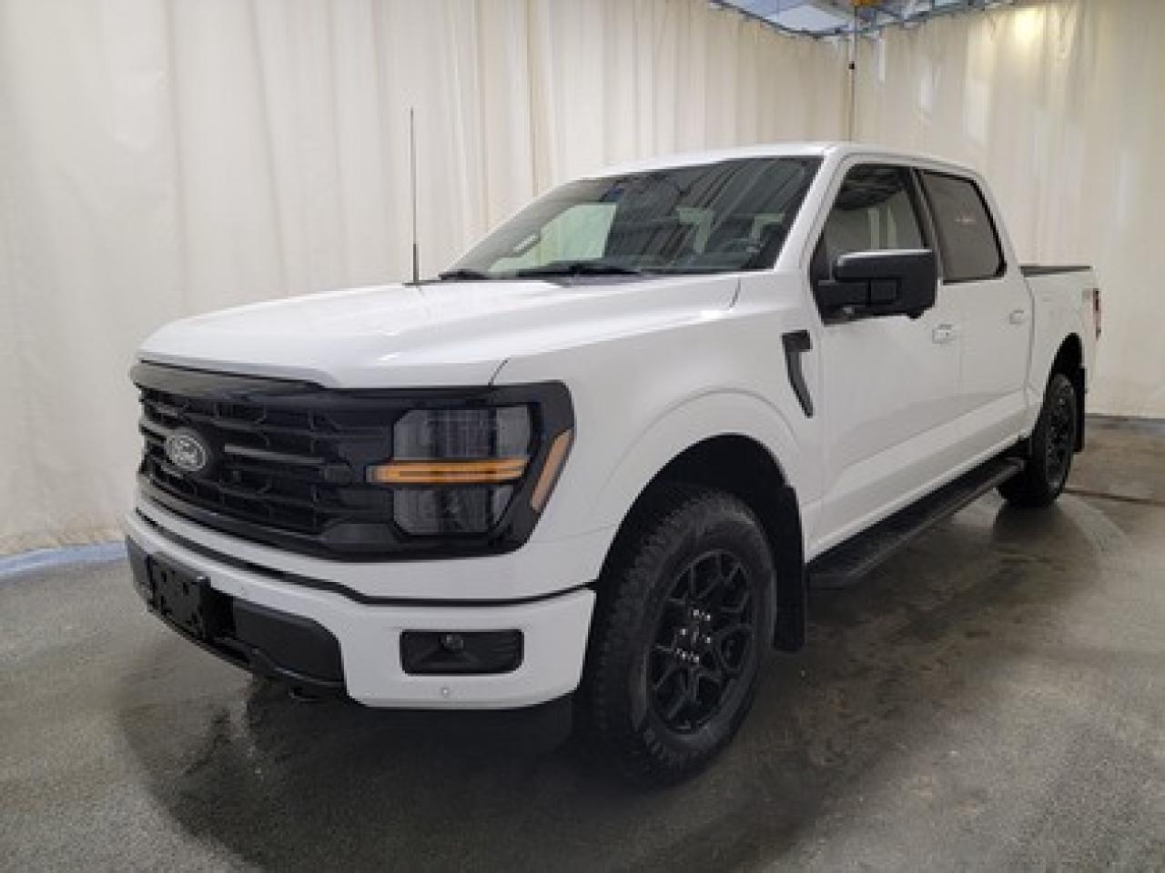 The all-new 2025 Ford F-150 XLT 302A is a statement of style in Oxford White. Powered by the 2.7L EcoBoost engine, it delivers 325 horsepower and 400 lb-ft of torque, paired with a 10-speed automatic transmission. This truck achieves an impressive, combined fuel economy of 11.8 L/100 km (24 miles per gallon).

Key Features:
12 LCD Captivity Touchscreen
Electronic Power-Assist Steering
Dual-Zone Electronic Auto Temp Control
Cruise Control
Power Windows
AdvanceTrac® With Roll Stability Control
Perimeter Alarm
Ford Co-Pilot360
Lane Keeping System
Rear View Camera
Rear Parking Sensors
Reverse Park Assist
Class IV Trailer Hitch
Power Drivers Seat
Remote Start
SYNC®4
Apple Car Play
18 All Terrain Tires
Bluetooth Connectivity
XLT Black Appearance Package
Engine Block Heater
FX4 Off Road Package
Bed Utility Package
Tailgate Step

From navigating Saskatchewan's rugged terrain to hauling gear for your next project, the 2025 Ford F-150 XLT combines capability, technology, and comfort into a trusted workhorse that adapts to your needs. Engineered for durability, the F-150 XLT offers heavy-duty shock absorbers, rear privacy glass, interior worksurface, dual exhaust tips and LED reflector headlamps. Inside, enjoy smart features like power windows, tilt/telescoping steering wheel, and USB charging ports for added convenience. Safety remains a priority with Post Collision Braking, Dynamic Brake Support, and advanced airbag systems.

Bennett Dunlop Ford, proudly serving Regina for over 40 years, is conveniently located at 770 Broad Street. With over 3,500 Google reviews, our reputation reflects our commitment to providing a fast, easy, and enjoyable vehicle-buying experience. We eliminate the hassle with no admin or documentation fees, transparent upfront pricing, and a money-back guarantee that lets you shop with total confidence. But were more than just a dealershipwere driven to make a difference by supporting local community initiatives and events that matter to you. Visit Bennett Dunlop Ford today and experience why were Reginas trusted choice for quality vehicles, exceptional service, and a genuine commitment to driving change in our community!