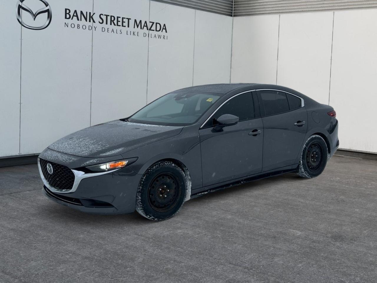 Step into the world of elegance and performance with this 2019 Mazda Mazda3 GS Auto FWD in a sleek sedan style. With a refined Automatic transmission and the efficiency of a Front-Wheel Drive system, this vehicle ensures a seamless driving experience thats both secure and responsive. The exterior of this Mazda3 captivates with its striking alloy wheels and dynamic design, making every drive a pleasure. Inside, comfort meets sophistication with a spacious cabin featuring Heated Front Seats and a Leather Steering Wheel that enhances every touch. Seamlessly integrate your smart device with connectivity options, while the enduring practicality of Power Windows and Keyless Entry enhance everyday convenience. Technology and safety are at the forefront of this model, boasting a Backup Camera for easy parking and Lane Assist to keep you confidently rooted on the road. Engage Adaptive Cruise Control for a stress-free highway journey, while Heated Mirrors ensure clarity in all conditions. This 2019 Mazda3 GS Auto FWD is tailor-made for professionals seeking a reliable and stylish companion for their daily commutes, as well as families desiring a safe, connected ride. Contact our dealership today to learn more and arrange your test drive.