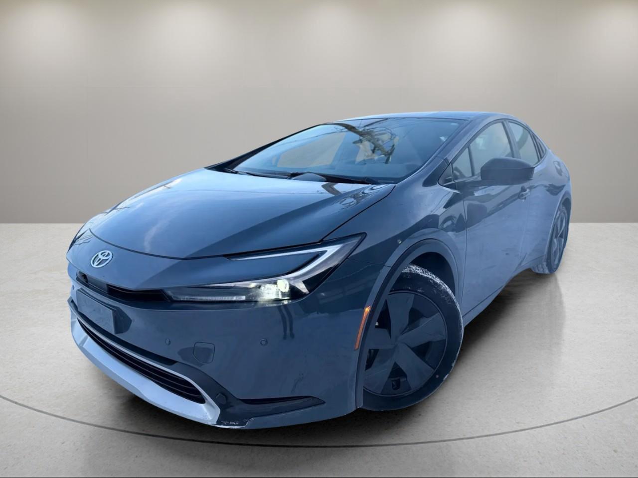 <p>Experience the 2023 Toyota Prius Prime in a sophisticated gray finish with front-wheel drive that offers responsive handling for your daily commute. This hatchback combines practicality with modern aesthetics, making it an ideal choice for those who value efficiency and style.</p><p>The exterior of the Prius Prime features sleek lines complemented by eye-catching alloy wheels, while the interior boasts a matching gray color scheme that exudes class and comfort. Enjoy the convenience and comfort of heated seats, ensuring your journeys are pleasant even on the coldest of days.</p><p>Stay connected with ease through the smart device integration and enjoy your favorite tunes with satellite radio. Safety is prioritized with advanced features such as lane assist and a backup camera, enhancing your confidence on the road. The inclusion of brake assist and keyless entry adds to the overall convenience and safety of the vehicle.</p><p>The 2023 Toyota Prius Prime is perfect for environmentally-conscious individuals who seek a vehicle that balances technology, safety, and economy. For more details or to schedule a test drive, we invite you to contact Yukon Nissan today.</p>