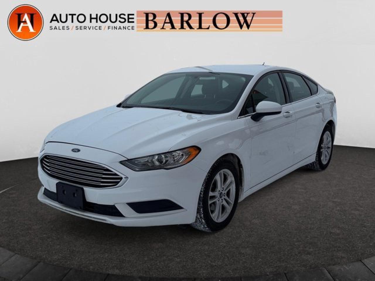 2018 FORD FUSION SE FWD WITH 85805 KMS, BACKUP CAMERA, PUSH BUTTON START, HEATED SEATS, BLUETOOTH, AND MUCH MORE!.ALL CREDIT ACCEPTED!One month at a job? Bankruptcy? New to Canada? Collections? Student or work visas? Previous repossessions? Good or bad credit? Weve got you covered! Get pre-approved today at www.autoshouse.com!What We Offer:*Low Bi-Weekly Payments*Instant Approvals*Credit Consolidation*Employment Insurance*Negative Equity CoverageOperating Hours:Mon-Thurs: 10 am -- 8 pmFri-Sat: 10 am -- 6 pmCall 403-263-4446! All vehicles come with a full mechanical fitness assessment.CARFAX IS AVAILABLE TO THE CONSUMER.Referral Program:Refer friends and family and earn $500 for each referral!AMVIC Licensed DealerAfter a credit check, we can determine payments, APR, terms, and interest rates based on your credit (O.A.C). Individual credit will affect bi-weekly payments and the total cost of credit . Newer Vehicles May Come With Apple Carplay, Android Auto. Similar to Chevrolet, GMC, Honda, Toyota, Cadillac, Nissan, Ford, Volvo 2007, 2008, 2009, 2010, 2011, 2012, 2013, 2014, 2015, 2016, 2017, 2018Location: 2404 23rd Ave. N.E. Calgary AB, T2E 8J4All photos are of the vehicle featured in the advertisement.