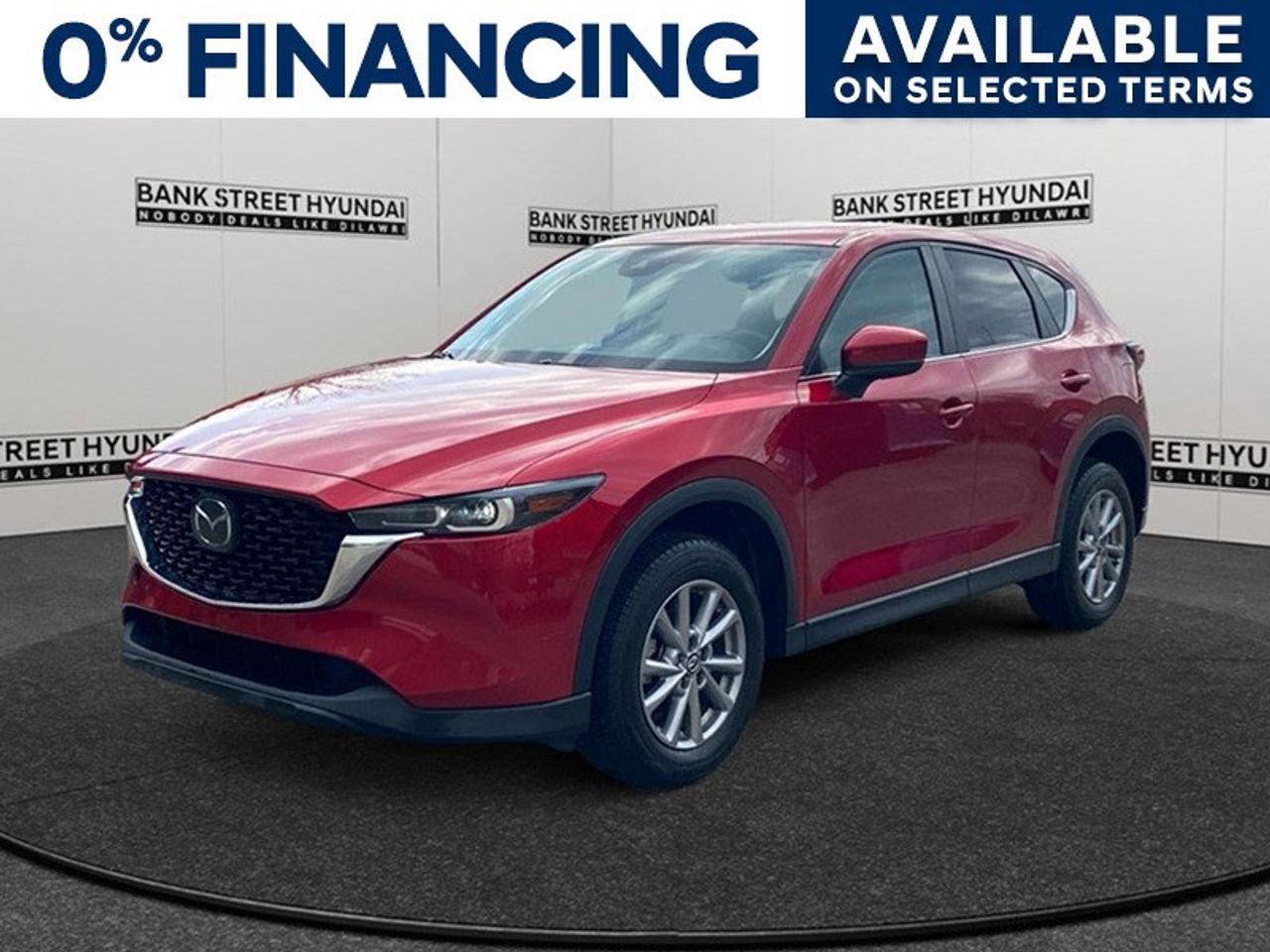 Experience the thrill of driving the 2023 Mazda CX-5 GS AWD in a stunning Red finish. This SUV, with its all-wheel drive and impressive handling, offers both style and capability for any journey. The exterior of the Mazda CX-5 shines with elegant alloy wheels and a distinct profile that captures attention. Step inside to find an inviting interior that boasts heated seats and power adjustments to ensure every drive is comfortable. With smart device integration and power windows, convenience is at your fingertips. Stay connected and safe with advanced technology features including a backup camera and Bluetooth connection. Enjoy peace of mind with driver assistance features such as lane assist and brake assist, designed to provide an extra layer of protection on the road. Perfect for the adventurous family or those who value style and reliability, the Mazda CX-5 seamlessly combines functionality and elegance. Dont miss out on this opportunitycontact us today to learn more and take this exceptional vehicle for a test drive.