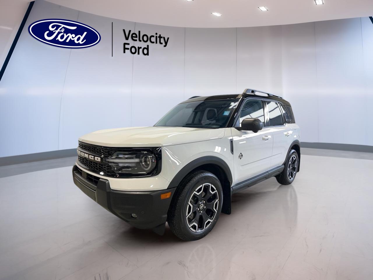 Experience adventure-ready versatility with the 2025 Ford Bronco Sport Outer Banks 4x4, now available at Velocity Ford in Moose Jaw. This used SUV, finished in classic white with a blue interior, combines rugged capability with refined comfort. With only 4,763 km on the odometer, it offers almost-new reliability and advanced features for your next journey.

FEATURES OF THE Bronco Sport Outer Banks 4x4  
»» Four-wheel drive for confident off-road handling  
»» Dual-zone automatic climate control for personalized comfort  
»» Heated front seats for cold Canadian mornings  
»» Ambient lighting package for a modern cabin feel  

ADVANCED SAFETY FEATURES  
»» Blind spot monitor for safer lane changes  
»» Lane departure warning to help keep you on track  
»» Side impact and head side airbags for all-around protection  
»» Child safety locks for added peace of mind  

PERFORMANCE AND EFFICIENCY  
»» 1.5-litre gas engine for balanced power and efficiency  
»» 8-speed automatic transmission for smooth shifting  
»» Four-wheel drive system for all-weather confidence  
»» Tire pressure monitoring for optimal safety  

COMFORT AND CONVENIENCE  
»» Power drivers seat with lumbar support  
»» Memory seats and mirrors for personalized settings  
»» Dual-zone climate control for driver and passenger comfort  
»» Illuminated vanity mirrors for both driver and passenger  

TECHNONOLGY AND CONNECTIVITY  
»» Bluetooth integration for hands-free communication  
»» Satellite radio for a wide range of entertainment  
»» Steering wheel audio controls for easy access  
»» Push button start for modern convenience  

CARGO SPACE  
»» Rear trunk access for easy loading  
»» Flexible cargo area for gear and groceries  
»» Split-folding rear seats to expand storage  
»» Ample room for weekend adventures  

WHAT OTHER OWNERS LIKE  
»» Comfortable ride quality on city streets and highways  
»» User-friendly technology and intuitive controls  
»» Versatile cargo space for active lifestyles  
»» Reliable all-weather capability with four-wheel drive  

This 2025 Ford Bronco Sport Outer Banks 4x4s VIN is: 3FMCR9CN9SRF12045.