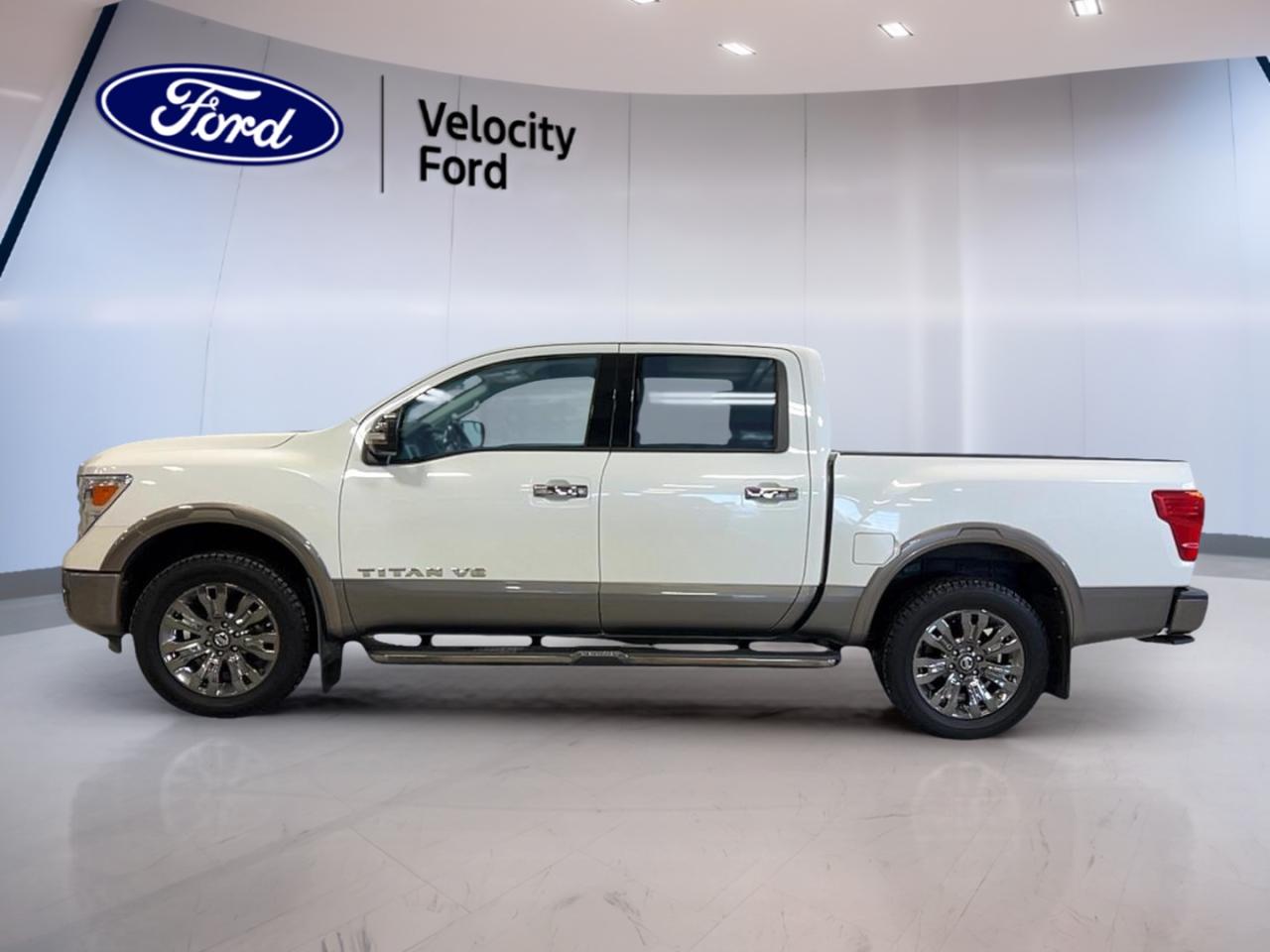 Discover the power and refinement of the 2018 Nissan Titan Platinum Crew Cab, now available at Velocity Ford in Moose Jaw. This full-size pickup stands out in white, offering a bold presence and four-door accessibility. With a robust 5.6-litre gas engine paired to a smooth automatic transmission, it delivers both strength and comfort for every drive.

TRUCK FEATURES
»» Towing capacity of 4,122 kg for heavy loads
»» Four-wheel drive (4WD) for enhanced traction
»» Rear tow hook for added utility
»» Steps for easy cabin access

ADVANCED SAFETY FEATURES
»» Anti-lock braking system (ABS) for secure stops
»» Blind spot monitor for added awareness
»» Side impact and head side airbags
»» Child safety locks for peace of mind

PERFORMANCE AND EFFICIENCY
»» 5.6-litre V8 engine for robust power
»» Limited slip differential for improved handling
»» Automatic transmission with dual shift mode
»» Tire pressure monitoring system

COMFORT AND CONVENIENCE
»» Dual-zone automatic climate control
»» Heated front and rear seats
»» Power windows and electric mirrors
»» Memory seats and drivers lumbar support

TECHNONOLGY AND CONNECTIVITY
»» Navigation system (GPS) for easy guidance
»» Bluetooth integration for hands-free calls
»» Satellite radio and HD radio entertainment
»» Steering wheel audio controls

CARGO SPACE
»» Rear trunk access for easy loading
»» Retractable mirrors for tight spaces
»» Spare tire for emergencies
»» Chrome wheels for added durability

WHAT OTHER OWNERS LIKE
»» Strong towing capability and 4WD performance
»» Comfortable ride with advanced climate control
»» User-friendly technology and navigation system
»» Safety features that inspire confidence


This 2018 Nissan Titan Platinum Crew Cabs VIN is: 1N6AA1E59JN540606.