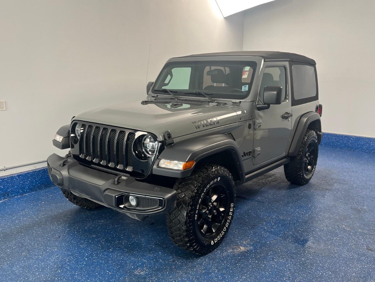 New Price! 2022 Jeep Wrangler Willys 2D Willys | Manual V6 | No Accidents | Zacks Certified. 6-Speed Manual 4WD Sting-Gray Clearcoat Pentastar 3.6L V6 VVT<br /><br /><br />1-Year SiriusXM Subscription, 220 Amp Alternator, 240 Amp Alternator, 4 Auxiliary Switches, 4- and 7-Pin Wiring Harness, 4-Wheel Drive Swing Gate Decal, 7''' Full-Colour Driver Info Display, 7''' Touchscreen, 700 Amp Maintenance Free Battery, Alpine Premium Audio System, AM/FM radio, Apple CarPlay Capable, Class II Hitch Receiver, Cloth Bucket Seats, Cold Weather Group, Convenience Group, Deep Tint Sunscreen Windows, Dual-Zone A/C w/Manual Temperature Control, Front 1-Touch Down Power Windows, Front Bucket Seats, Front fog lights, Front Heated Seats, Front License Plate Bracket, Fully automatic headlights, Gloss Black Sport Grille, Google Android Auto, GPS Antenna Input, Hands-Free Communication w/Bluetooth, Heated Steering Wheel, Integrated Centre Stack Radio, Integrated roll-over protection, Leather-Wrapped Steering Wheel, LED Fog Lamps, LED Headlamp & Fog Lamp Group, LED Reflector Headlamps, Matte Black Jeep Badge, MOPAR All-Weather Floor Mats, MOPAR Front Grab Handles, MOPAR Grab Handle Kit, Moulded-In-Colour Bumper w/Gloss Black, Moulded-In-Colour Fender Flares, ParkView Rear Back-Up Camera, Power Heated Exterior Mirrors, Quick Order Package 23W Willys, Radio: Uconnect 3 w/5''' Display, Radio: Uconnect 4 w/7''' Display, Remote Keyless Entry, Remote Proximity Keyless Entry, Rock Protection Sill Rails, Security Alarm, SiriusXM Guardian Trial Included, SiriusXM Satellite Radio, Speed-Sensitive Power Locks, Sun Visors w/Illuminated Vanity Mirrors, Technology Group, Telescoping steering wheel, Tilt steering wheel, Trac-Lok Limited-Slip Rear Differential, Trailer Tow & HD Electrical Group, Universal Garage Door Opener, USB Mobile Projection, Wheels: 17''' x 7.5''' Moab Black Aluminum, Willys Hood Decal.<br /><br />Certification Program Details: Fresh 2 Yr MVI | 30 day warranty* | 110 point inspection | Full tank of fuel | Krown rustproofed | Flexible financing options | Professionally detailed<br /><br />This vehicle is Zacks Certified! You're approved! We work with you. Together we'll find a solution that makes sense for your individual situation. Please visit us or call 902 843-3900 to learn about our great selection.<br /><br />With 22 lenders available Zack's Auto Sales can offer our customers with the lowest available interest rate. Thank you for taking the time to check out our selection!