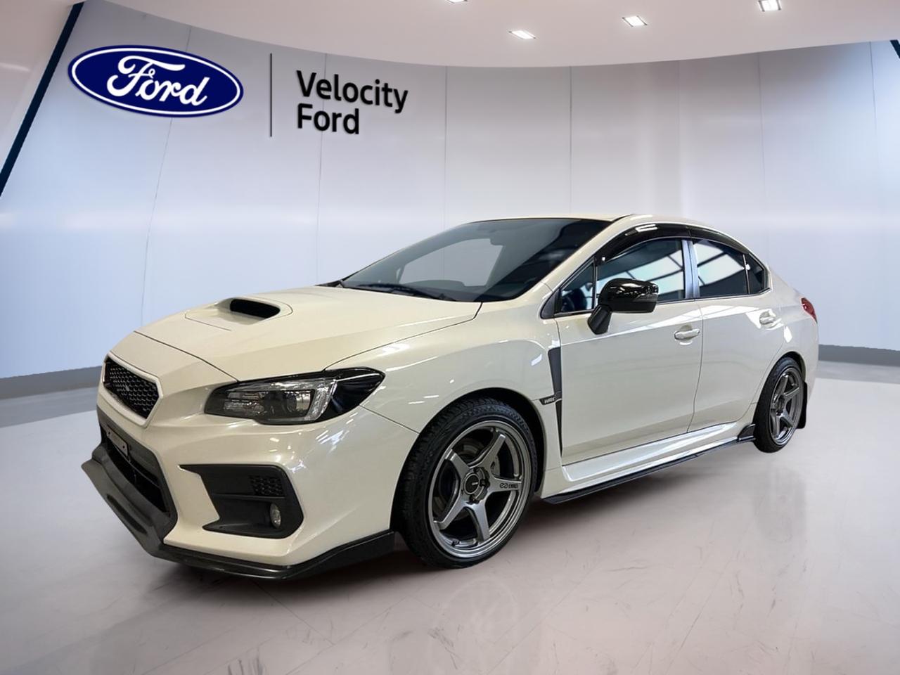 // ACCIDENT FREE!! //

Experience pure driving excitement with the 2018 Subaru WRX Sport Manual, now available at Velocity Ford in Moose Jaw. This accident-free sedan, as confirmed by CARFAX Canada, boasts a white exterior and a sporty 6-speed manual transmission. With only 94,327 km, it delivers a dynamic and engaging drive every time you get behind the wheel.

FEATURES OF THE WRX Sport Manual  
»» 6-speed manual transmission for full driver control  
»» Power sunroof for open-air enjoyment  
»» Limited slip differential for enhanced traction  
»» Rear spoiler for a sporty appearance  

ADVANCED SAFETY FEATURES  
»» Blind spot monitor for safer lane changes  
»» Anti-lock braking system (ABS) for confident stops  
»» Multiple airbags including side impact protection  
»» Child safety locks for family peace of mind  

PERFORMANCE AND EFFICIENCY  
»» 2.0-litre turbocharged gas engine  
»» Performance tires for superior grip  
»» Stability control for confident handling  
»» Rear window defroster for all-weather visibility  

COMFORT AND CONVENIENCE  
»» Heated front seats for cold weather comfort  
»» Automatic climate control for perfect cabin temperature  
»» Power drivers seat with lumbar support  
»» Adjustable steering wheel for personalized fit  

TECHNONOLGY AND CONNECTIVITY  
»» Bluetooth integration for hands-free calls  
»» Satellite radio for diverse entertainment options  
»» Steering wheel audio controls for easy access  
»» Backup camera for effortless parking  

CARGO SPACE  
»» Spacious trunk with remote release  
»» Rear trunk access for easy loading  
»» Spare tire included for emergencies  
»» Ample room for everyday essentials  

WHAT OTHER OWNERS LIKE  
»» Engaging manual transmission driving experience  
»» Confident all-weather handling and stability  
»» Comfortable heated seats and climate controls  
»» Modern safety and connectivity features  

This 2018 Subaru WRX Sport Manuals VIN is: JF1VA1D64J9830149.