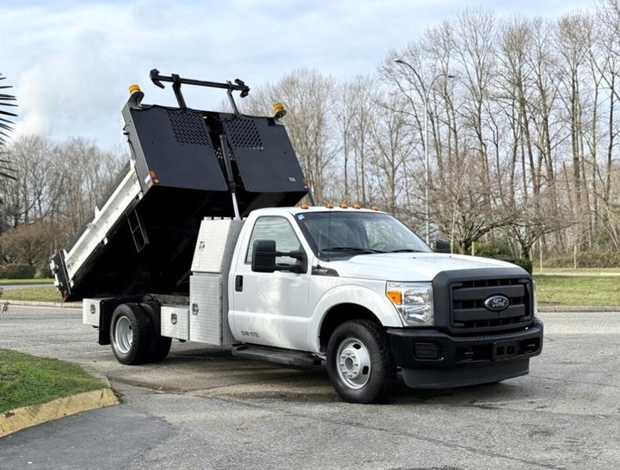 This 2015 Ford F-350 XL Super Duty dually dump truck is equipped with a 9-foot dump body and powered by a 6.2L V8 gas engine paired with an automatic transmission and rear-wheel drive. It features a PTO-driven hoist, auxiliary switches, dump awning cover, traffic arrow control panel, and multiple storage compartments. Inside dump dimensions measure approximately 9 ft 5 in long by 7 ft 4 in wide. Additional equipment includes air conditioning, AM/FM radio with CD player, 4-wheel ABS, and a vinyl interior. Overall vehicle dimensions are approximately 22 ft long, 8 ft 4 in wide, and 8 ft 8 in high, making it well-suited for construction, landscaping, and municipal applications. This item is currently OFFSITE. You must register an appointment with our office to schedule an offsite viewing. Appointments must be made a minimum of one business day in advance (and as defined by the days that Repo.com is open for business) before your appointment can be scheduled and confirmed. We may, at our own discretion, instead opt to transport smaller items to Repo.coms main yard for viewing purposes.  $39,980.00 plus $375 processing fee, $40,355.00 total payment obligation before taxes.  Listing report, warranty, contract commitment cancellation fee, financing available on approved credit (some limitations and exceptions may apply). All above specifications and information is considered to be accurate but is not guaranteed and no opinion or advice is given as to whether this item should be purchased. We do not allow test drives due to theft, fraud, acts of vandalism and undetectable impaired driving. Instead we provide the following benefits: Complimentary Warranty (with options to extend), Limited Money Back Satisfaction Guarantee on Fully Completed Contracts, Contract Commitment Cancellation, and an Open-Ended Sell-Back Option. Ask seller for details or call 604-522-REPO(7376) to confirm listing availability.