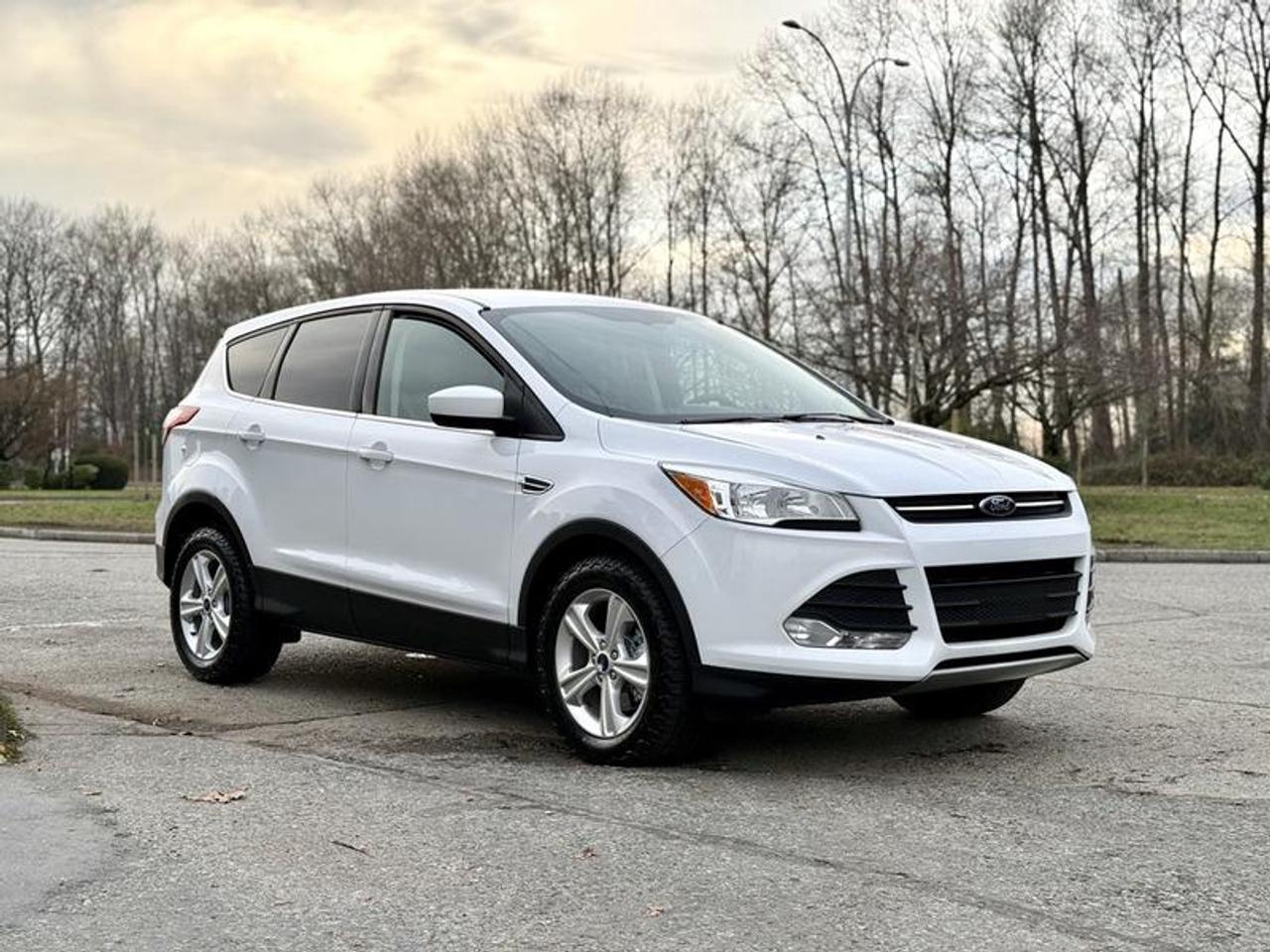 This 2014 Ford Escape SE 4WD is a compact SUV configured for everyday driving with all-wheel traction and a practical interior layout. Powered by a 1.6L 4-cylinder engine with automatic transmission, it features four doors, seating for passengers and cargo, and a white exterior with beige cloth interior. Equipment includes AM/FM radio with Bluetooth, air conditioning and heat, cruise control, heated seats, power windows, power door locks, power mirrors, a reverse camera, privacy trunk cover, and multiple cup holders. The Escape SE offers a balanced size for commuting, errands, and light utility while maintaining a compact footprint suitable for city and highway use. This item is currently OFFSITE. You must register an appointment with our office to schedule an offsite viewing. Appointments must be made a minimum of one business day in advance (and as defined by the days that Repo.com is open for business) before your appointment can be scheduled and confirmed. We may, at our own discretion, instead opt to transport smaller items to Repo.coms main yard for viewing purposes.  $13,770.00 plus $375 processing fee, $14,145.00 total payment obligation before taxes.  Listing report, warranty, contract commitment cancellation fee, financing available on approved credit (some limitations and exceptions may apply). All above specifications and information is considered to be accurate but is not guaranteed and no opinion or advice is given as to whether this item should be purchased. We do not allow test drives due to theft, fraud, acts of vandalism and undetectable impaired driving. Instead we provide the following benefits: Complimentary Warranty (with options to extend), Limited Money Back Satisfaction Guarantee on Fully Completed Contracts, Contract Commitment Cancellation, and an Open-Ended Sell-Back Option. Ask seller for details or call 604-522-REPO(7376) to confirm listing availability.