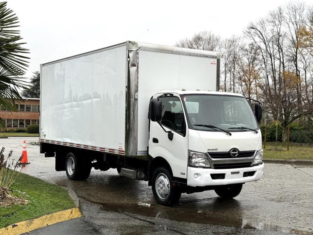 This 2019 Hino 195 Cube Van is equipped with an 18-foot enclosed cargo box and a power lift gate, powered by a 5.1L 4-cylinder diesel engine paired with an automatic transmission and rear-wheel drive. The cargo area measures approximately 18 feet long, 8 feet wide, and 7 feet 8 inches high, providing generous interior volume for deliveries, freight, or equipment transport. The power lift gate offers an estimated 1,100 lb to 2,200 lb lifting capacity, supporting efficient loading and unloading. Cab features include air conditioning and heat, AM/FM radio with CD player, cruise control, engine brake, heated mirrors, power windows, power mirrors, window lock, and cup holders. Finished in white with a grey cloth interior, the overall vehicle measures roughly 25 feet 7 inches long, 8 feet 6 inches wide, and 11 feet 2 inches high, making it well-suited for commercial delivery and box truck applications. This item is currently OFFSITE. You must register an appointment with our office to schedule an offsite viewing. Appointments must be made a minimum of one business day in advance (and as defined by the days that Repo.com is open for business) before your appointment can be scheduled and confirmed. We may, at our own discretion, instead opt to transport smaller items to Repo.coms main yard for viewing purposes.  $48,720.00 plus $375 processing fee, $49,095.00 total payment obligation before taxes.  Listing report, warranty, contract commitment cancellation fee, financing available on approved credit (some limitations and exceptions may apply). All above specifications and information is considered to be accurate but is not guaranteed and no opinion or advice is given as to whether this item should be purchased. We do not allow test drives due to theft, fraud, acts of vandalism and undetectable impaired driving. Instead we provide the following benefits: Complimentary Warranty (with options to extend), Limited Money Back Satisfaction Guarantee on Fully Completed Contracts, Contract Commitment Cancellation, and an Open-Ended Sell-Back Option. Ask seller for details or call 604-522-REPO(7376) to confirm listing availability.