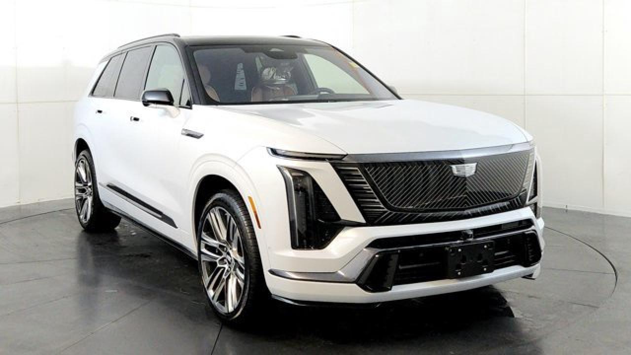 The 2026 Cadillac VISTIQ Platinum is the top-tier luxury version of Cadillacs three-row all-electric SUV, combining exclusive exterior accents, Brembo brakes, a black roof, and 22-inch polished wheels with rich interior finishes like open-pore Black Ash trim. It builds on the VISTIQs advanced tech and premium comfort features --- including a panoramic dual-pane sunroof, 23-speaker AKG audio with Dolby Atmos, and a curved 33-inch diagonal LED display while retaining the dual-motor AWD system and roomy three-row cabin layout characteristic of the model. With its blend of upscale design details, cutting-edge infotainment and driver-assist tech, and electric performance, the Platinum trim stands out as the most refined and feature-rich VISTIQ available.