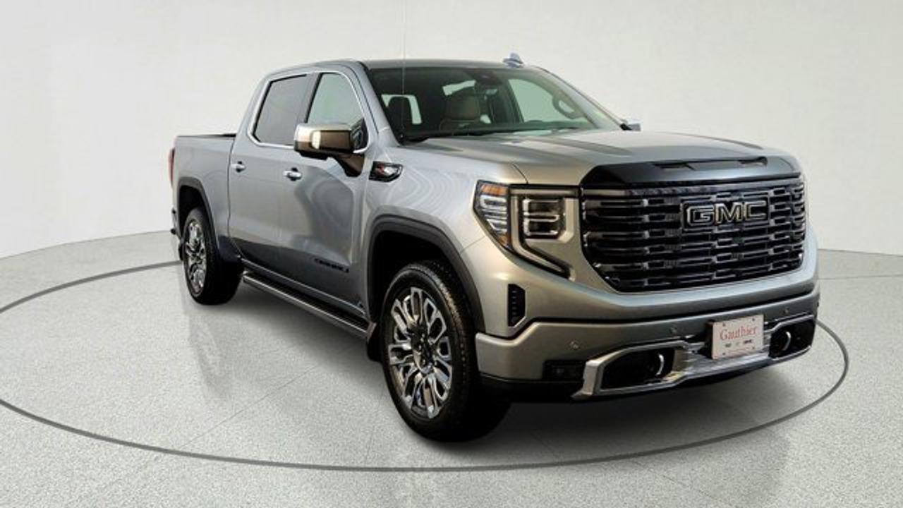 The 2026 GMC Sierra 1500 Denali Ultimate stands at the pinnacle of truck luxury. Power is delivered from a 6.2-liter V8 paired with a smooth 10-speed automatic transmission on 22-inch wheels. Inside, the cabin is a technology-rich sanctuary featuring 16-way heated, ventilated, and massaging leather seats, a high-resolution 13.4-inch infotainment screen with wireless smartphone integration, a 12-speaker Bose surround sound system, Super Cruise hands-free driving, and a multicolor head-up display---all enveloped in premium materials like full-grain leather, open-pore wood, and acoustic glass. A black GMC badging package rounds out the look.