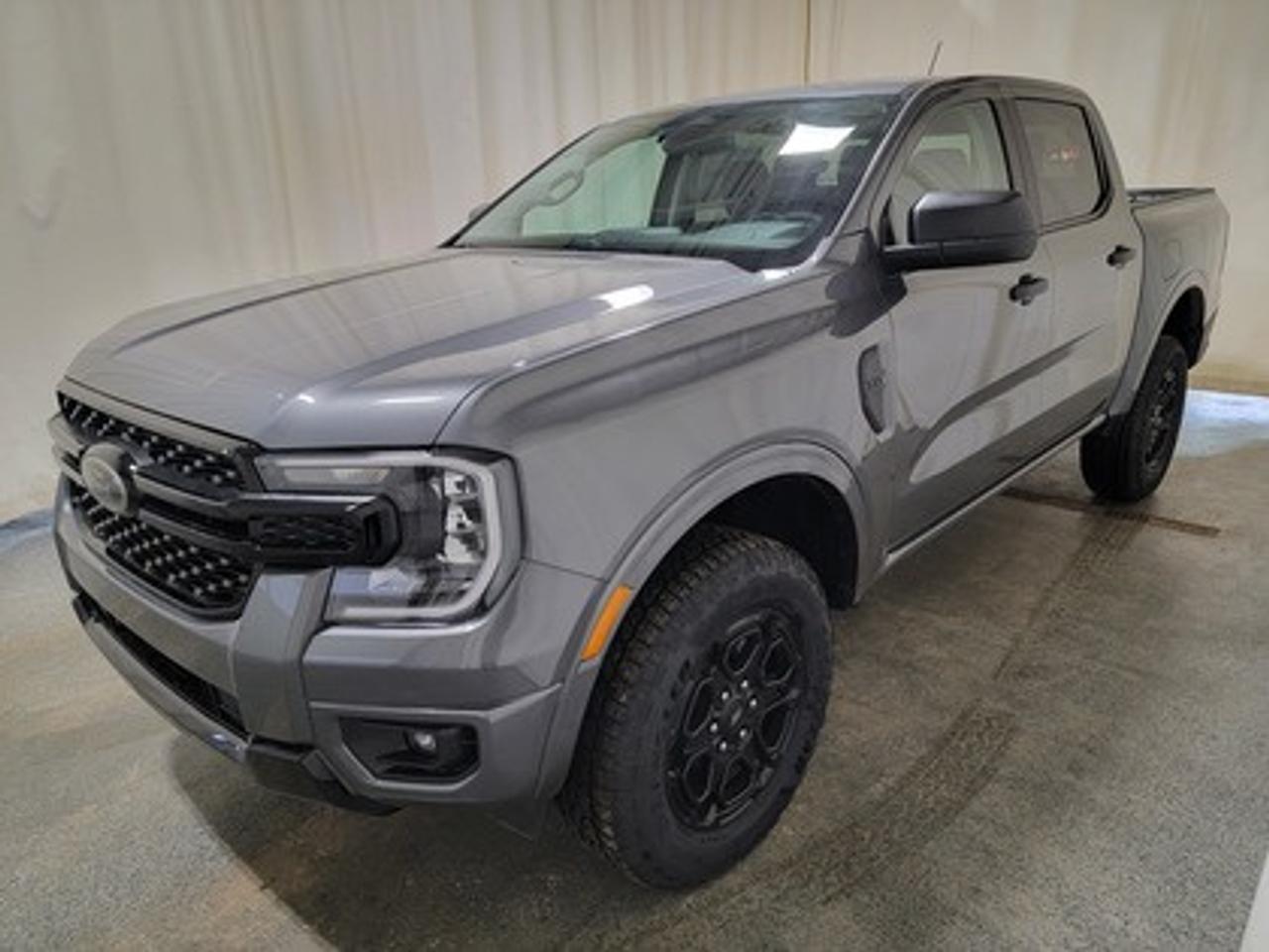 This all-new 2026 Ford Ranger XLT 301A looks absolutely stunning in Carbonized Grey Metallic. This versatile compact pickup comes equipped with the 2.3L EcoBoost® engine, producing 270 horsepower and 310 lb-ft of torque. By leveraging EcoBoost® technology and a 10-speed automatic transmission, this truck is designed to achieve 11.2L/100 km (25 miles per gallon) combined highway/city fuel economy.

This vehicle comes with the All-Weather Packageready to take on any season!
Snow, rain, mud, or sunshinethis vehicle is built for it all! The All-Weather Package adds extra protection where it matters most, with premium mud flaps to shield your paint from road debris, all-weather floor mats to protect your interior from lifes messes, and Xpel paint protection to help guard against those infuriating rock chips. Drive with confidence, knowing your investment is protected from Regina's elements.

Key Features:
12 Centre Display
Dual Zone Temperature Control 
Rear Window W/Privacy Glass & Defrost
Ford Co-Pilot360
Rear View Camera
Lane Keeping System 
Rear Parking Sensors
Reverse Break Assist 
10-Way Power Drivers Seat 
Heated Front Seats 
17 Grey Painted Aluminum Wheels
Cruise Control
FordPass Connect
Selectable Drive Modes
8 Cluster Display
FX4 Off Road Package
Black Appearance Package
Advanced Towing Package
Engine Block Heater

Bennett Dunlop Ford, proudly serving Regina for over 40 years, is conveniently located at 770 Broad Street. With over 3,500 Google reviews, our reputation reflects our commitment to providing a fast, easy, and enjoyable vehicle-buying experience. We eliminate the hassle with no admin or documentation fees, transparent upfront pricing that lets you shop with total confidence. But were more than just a dealershipwere driven to make a difference by supporting local community initiatives and events that matter to you. Visit Bennett Dunlop Ford today and experience why were Reginas trusted choice for quality vehicles, exceptional service, and a genuine commitment to driving change in our community!