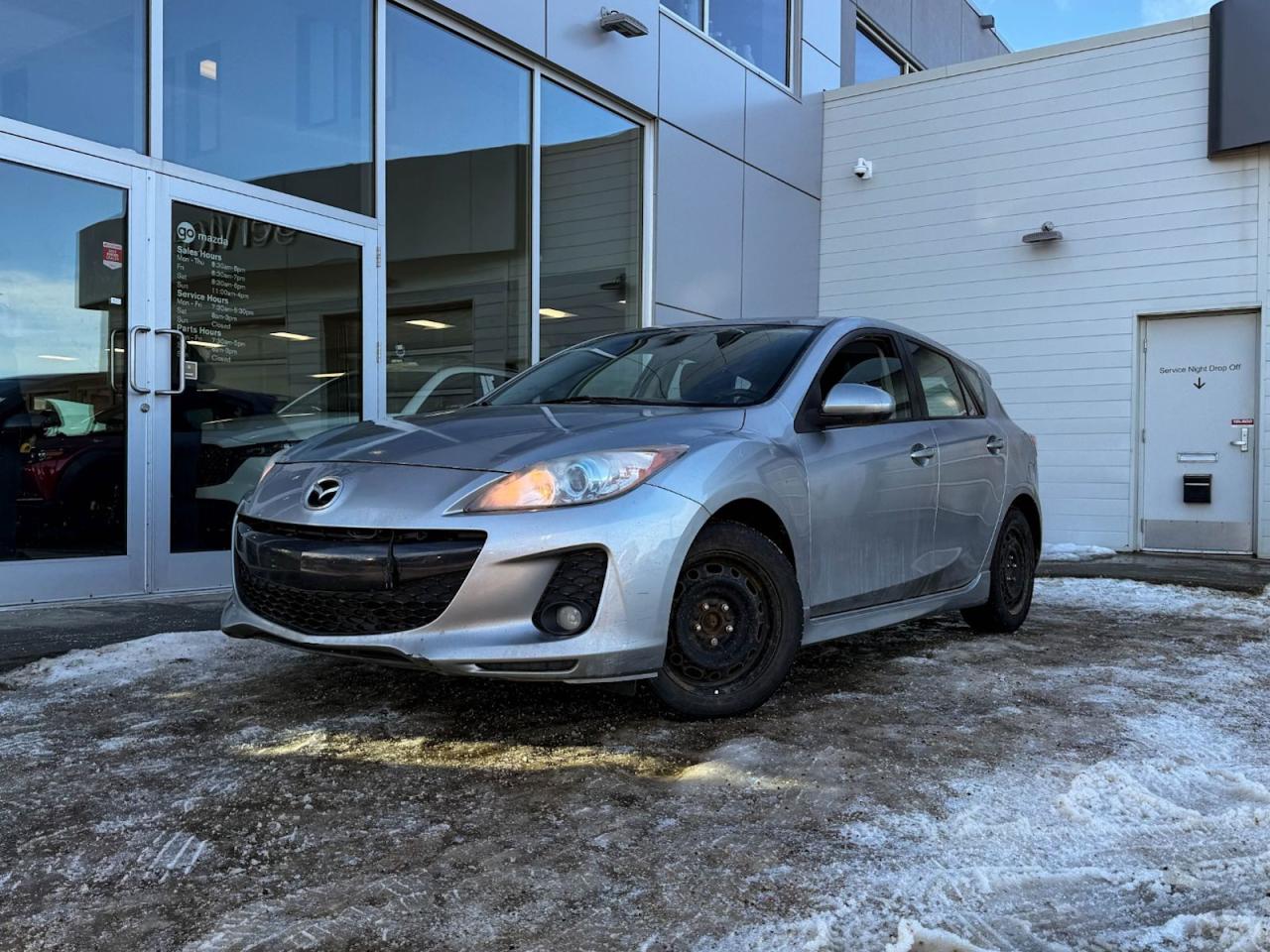 Discover the thrill of driving with this pre-owned 2013 Mazda Mazda3 GS-SKY 4dr HB Sport Auto in sophisticated Aluminum Metallic Mica. Powered by a smooth 6-speed manual transmission paired with front-wheel drive and advanced stability controls, this sporty hatchback offers an engaging and confident ride.Enjoy heated front seats, a leather-wrapped steering wheel, and a well-appointed interior featuring metal-look accents and intuitive controls. Safety is paramount with 6 airbags, ABS, traction control, and reinforced galvanized steel body panels.Stay connected and entertained with Bluetooth wireless streaming, steering wheel audio controls, and a single-disc CD player with auxiliary input. Practical features like a fold-flat 60/40 rear seat, rear spoiler, and cargo area tie-downs ensure this Mazda3 fits your active lifestyle.Experience reliability, sporty performance, and comfortall in one stylish package. Schedule your test drive today at Go Mazda and drive home this exceptional 2013 Mazda3 GS-SKY!Go Mazda is an AMVIC licensed business.This vehicle is showing a CarFax incident in the amount of $10,336.29