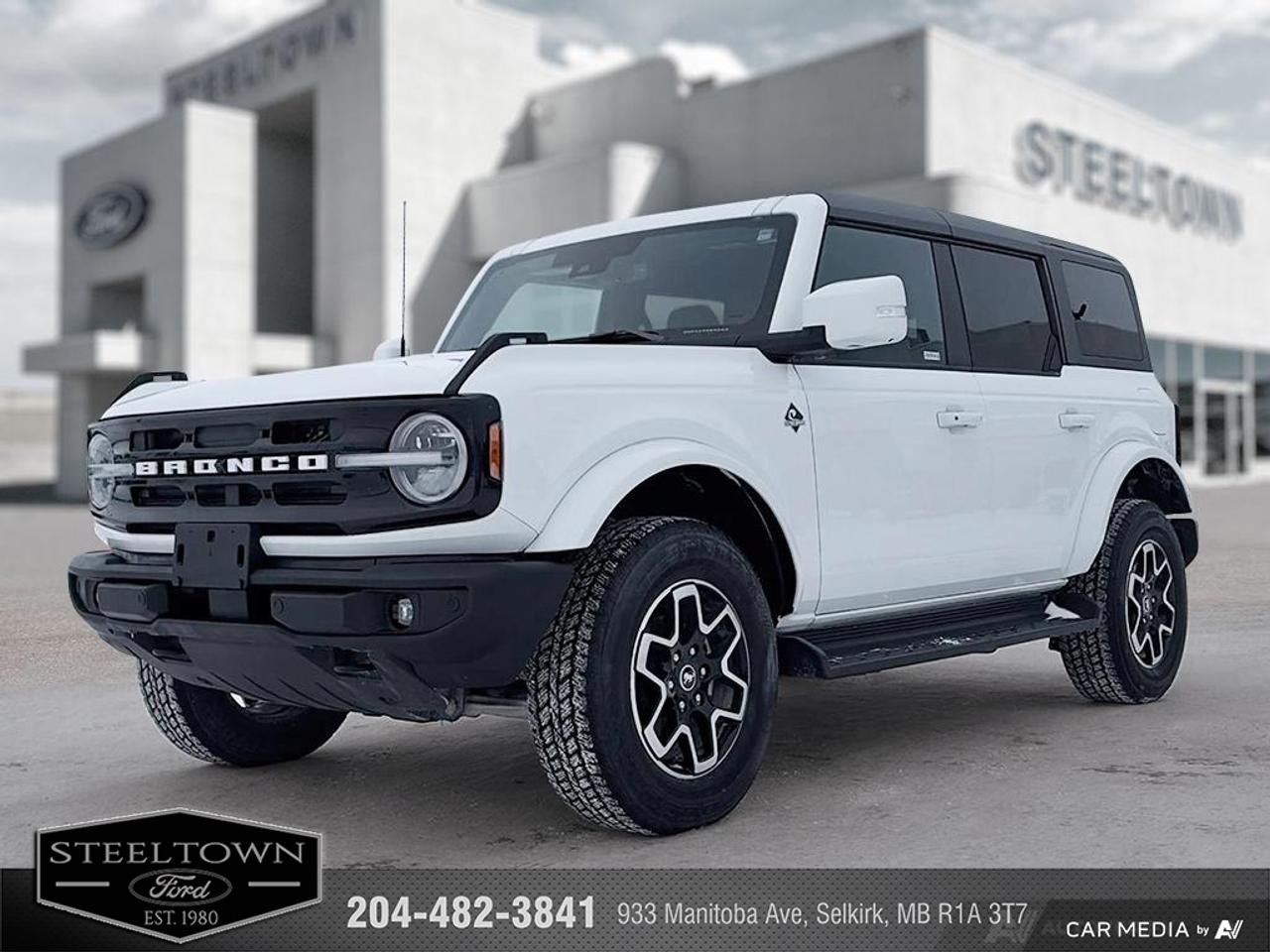 <b>Low Mileage, Navigation,  Heated Seats,  Remote Start,  Blind Spot Detection,  Lane Keep Assist!</b><br> <br> We value your TIME, we wont waste it or your gas is on us!   We offer extended test drives and if you cant make it out to us we will come straight to you!<br><br><br> <br>With cool retro-styling, innovative features and impressive off-road capability, this legendary 2025 Ford Bronco has very little to prove. This 2025 Ford Bronco is for sale today in Selkirk.<br> <br>With a nostalgia-inducing design along with remarkable on-road driving manners with supreme off-road capability, this 2025 Ford Bronco is indeed a jack of all trades and masters every one of them. Durable build materials and functional engineering coupled with modern day infotainment and driver assistive features ensure that this iconic vehicle takes on whatever you can throw at it.<br> <br>This low mileage SUV has just 7,600 km. Its nice in colour and is completely accident free based on the <a href=https://vhr.carfax.ca/?id=fc0ZPLcZpzh2RsL5rQGN3L6qJpayGyDM target=_blank>CARFAX Report</a>. It has an Automatic transmission and is powered by a 275HP 2.3L 4 Cylinder Engine. <br> <br> Our Broncos trim level is Outer Banks. This Bronco Outer Banks takes things to a whole new level, with polished aluminum wheels, body colored fender flares, door handles and power heated side mirrors, along with LED headlights with high beam assist, front fog lights, and upgraded LED brake lights. This rugged off-roader also treats you with amazing comfort and connectivity features that include heated front seats, remote engine start, dual-zone climate control, front and rear cupholders, and an upgraded infotainment system with Apple CarPlay, Android Auto, SiriusXM and inbuilt navigation, to get you back home from your off-road adventures. Road safety is assured thanks to a suite of systems including blind spot detection, pre-collision assist with pedestrian detection and cross-traffic alert, lane keeping assist with lane departure warning, rear parking sensors, and driver monitoring alert. Additional features include proximity keyless entry with push button start, trail control, trail turn assist, and so much more. This vehicle has been upgraded with the following features: Navigation, Heated Seats, Remote Start, Blind Spot Detection, Lane Keep Assist, Aluminum Wheels, Sunroof.<br> To view the original window sticker for this vehicle view this <a href=http://www.windowsticker.forddirect.com/windowsticker.pdf?vin=1FMDE8BH5SLA58591 target=_blank>http://www.windowsticker.forddirect.com/windowsticker.pdf?vin=1FMDE8BH5SLA58591</a>. <br/><br> <br>To apply right now for financing use this link: <a href=http://www.steeltownford.com/?https://CreditOnline.dealertrack.ca/Web/Default.aspx?Token=bf62ebad-31a4-49e3-93be-9b163c26b54c&La target=_blank>http://www.steeltownford.com/?https://CreditOnline.dealertrack.ca/Web/Default.aspx?Token=bf62ebad-31a4-49e3-93be-9b163c26b54c&La</a><br> <br/><br>Family owned and operated in Selkirk for 35 Years.  <br>Steeltown Ford is located just 20 minutes North of the Perimeter Hwy, with an onsite banking center that offers free consultations. <br>Ask about our special dealer rates available through all major banks and credit unions.<br><br><br>Steeltown Ford Protect Plus includes:<br>- Life Time Tire Warranty <br>Cars cost less in Selkirk <br><br>Dealer Permit # 1039<br><br><br> Come by and check out our fleet of 90+ used cars and trucks and 230+ new cars and trucks for sale in Selkirk.  o~o