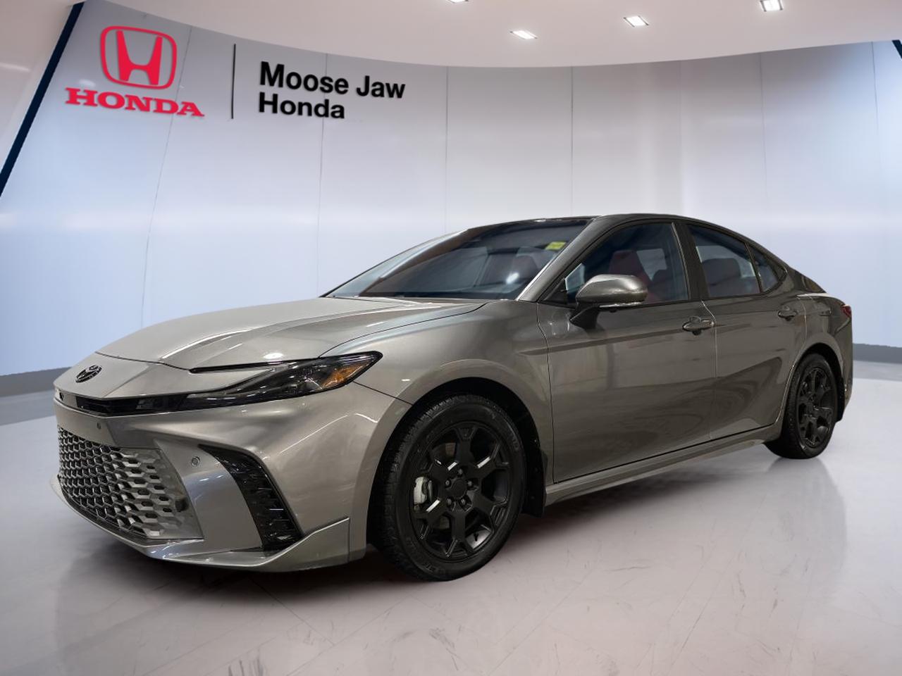 Experience the perfect blend of innovation and performance with the 2025 Toyota Camry XSE, now available at Moose Jaw Honda. This used sedan offers a dynamic driving experience with its advanced 2.5L Dynamic Force 4-Cylinder engine and intelligent all-wheel drive. Ideal for Canadian roads, it delivers both confidence and efficiency for daily commutes or weekend getaways.

FEATURES OF THE Camry XSE  
»» 2.5L Dynamic Force 4-Cylinder DOHC 16V engine  
»» Continuously Variable Transmission (CVT-i) for smooth shifting  
»» All-wheel drive traction for enhanced control  
»» Distinctive Camry XSE exterior and interior design  

ADVANCED SAFETY FEATURES  
»» Comprehensive airbag system for occupant protection  
»» Advanced traction control for all-weather stability  
»» Anti-lock braking system for safer stops  
»» Electronic brake-force distribution for balanced braking  

PERFORMANCE AND EFFICIENCY  
»» 2.5L engine offers responsive acceleration  
»» CVT-i transmission maximizes fuel efficiency  
»» All-wheel drive adapts to changing road conditions  
»» Engineered for reliable performance year-round  

COMFORT AND CONVENIENCE  
»» Spacious seating for driver and passengers  
»» Dual-zone climate control for personalized comfort  
»» Power adjustable drivers seat for optimal positioning  
»» Ample legroom in both front and rear  

TECHNOLOGY AND CONNECTIVITY  
»» Integrated infotainment system for easy access  
»» Bluetooth connectivity for hands-free communication  
»» USB ports for device charging and media  
»» Steering wheel-mounted controls for convenience  

CARGO SPACE  
»» Generous trunk capacity for luggage or groceries  
»» Split-folding rear seats for extended storage  
»» Wide trunk opening for easy loading  
»» Practical layout for everyday usability  

WHAT OTHER OWNERS LIKE  
»» Confident all-wheel drive handling in all seasons  
»» Smooth and efficient CVT-i transmission  
»» Comfortable and spacious interior layout  
»» Modern, easy-to-use technology features