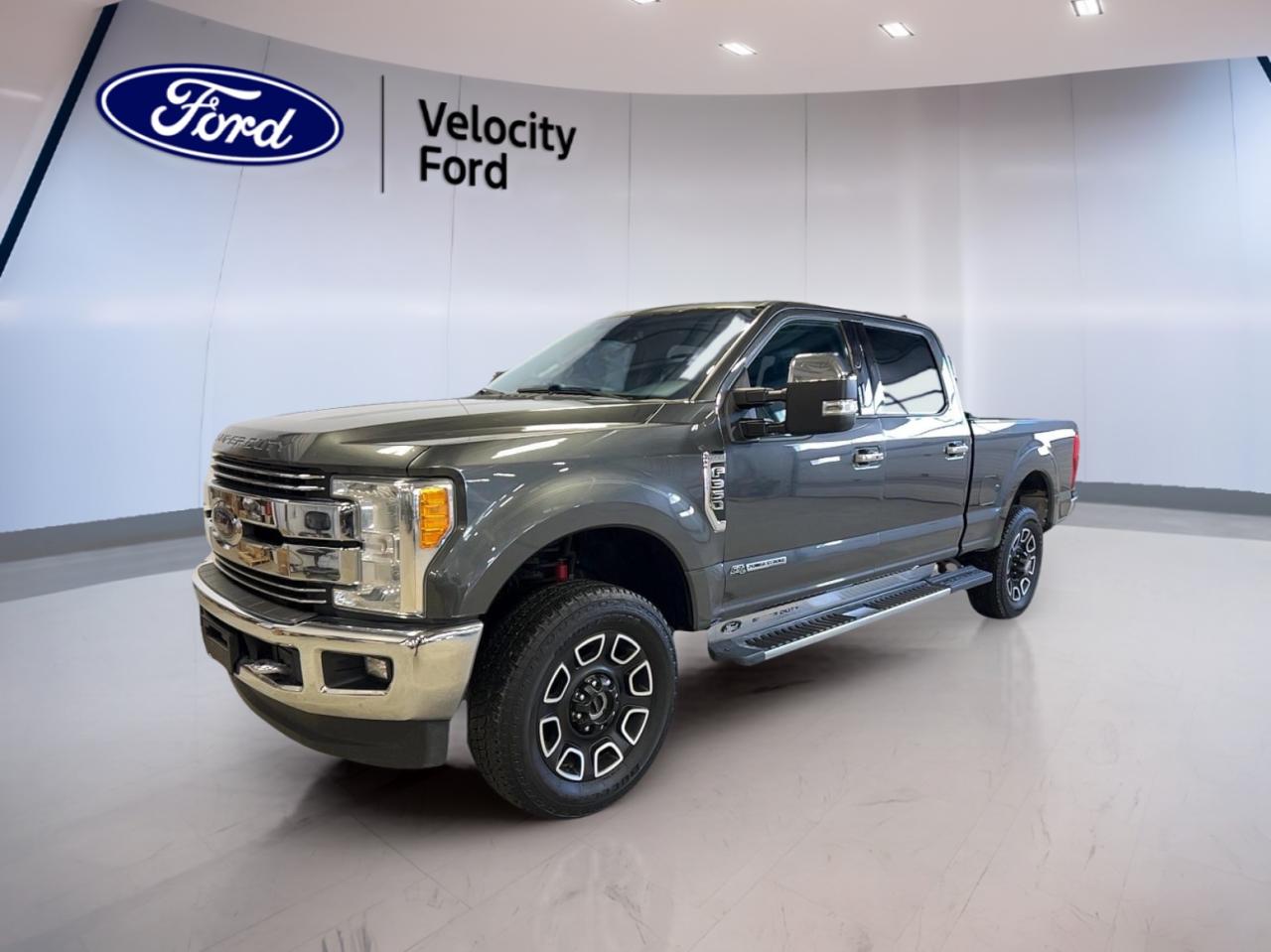 Experience the power and versatility of the 2017 Ford Super Duty F-350 SRW Lariat Crew Cab, now available at Velocity Ford in Moose Jaw. With a robust 6.7-litre diesel engine, automatic transmission, and four-wheel drive, this grey exterior, black interior truck is ready for demanding jobs and long journeys. Boasting 225,451 km, this Crew Cab delivers comfort, advanced features, and impressive capability for work or play.

TRUCK FEATURES
»» Towing capacity of up to 12,000 kg  
»» Four-wheel drive for tough terrains  
»» Rear tow hook for added utility  
»» Limited slip differential for better traction  

ADVANCED SAFETY FEATURES
»» Anti-lock braking system (ABS)  
»» Stability control for confident handling  
»» Driver, passenger, and side impact airbags  
»» Child safety locks for rear passengers  

PERFORMANCE AND EFFICIENCY
»» 6.7-litre diesel engine for strong performance  
»» Automatic 6-speed transmission for smooth shifts  
»» Dual shift mode transmission for flexibility  
»» Tire pressure monitoring for safety  

COMFORT AND CONVENIENCE
»» Heated front seats for cold mornings  
»» Dual-zone automatic climate control  
»» Adjustable pedals for custom comfort  
»» Memory seats and mirrors for easy recall  

TECHNONOLGY AND CONNECTIVITY
»» Bluetooth integration for hands-free calls  
»» WiFi hotspot for on-the-go connectivity  
»» HD radio and satellite radio for entertainment  
»» Steering wheel audio controls for convenience  

CARGO SPACE
»» Rear trunk access for easy loading  
»» Steps for simple cabin and bed access  
»» Spacious Crew Cab for passengers and gear  
»» Spare tire included for peace of mind  

WHAT OTHER OWNERS LIKE
»» Exceptional towing and hauling capability  
»» Comfortable, well-appointed cabin  
»» Advanced safety and driver assistance features  
»» Reliable performance in all conditions  


This 2017 Ford Super Duty F-350 SRW Lariat Crew Cabs VIN is: 1FT8W3BT1HED74139.
