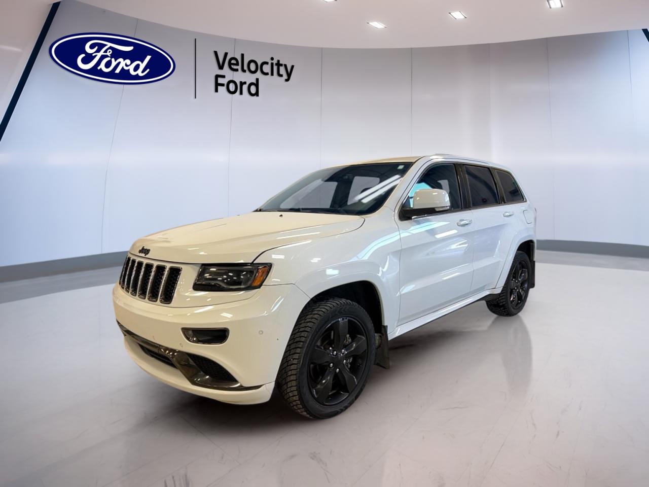 Experience refined capability and comfort with the 2015 Jeep Grand Cherokee Overland, now available at Velocity Ford in Moose Jaw. This white SUV delivers a premium driving experience with its 3.0-litre diesel engine, automatic 8-speed transmission, and four-wheel drive, ensuring both power and efficiency for Canadian roads. With 141,298 km on the odometer, it stands out as a reliable and well-equipped choice for drivers seeking luxury, technology, and rugged performance in one sophisticated package.

FEATURES OF THE Grand Cherokee Overland  
»» Panoramic sunroof for expansive sky views  
»» Air suspension for a smooth, adaptive ride  
»» Premium navigation system (GPS) included  
»» Power liftgate for easy cargo access  

ADVANCED SAFETY FEATURES  
»» Anti-lock braking system (ABS) for enhanced control  
»» Stability control for secure handling  
»» Side impact and head side airbags  
»» Child safety locks for rear passengers  

PERFORMANCE AND EFFICIENCY  
»» 3.0-litre diesel engine for robust torque  
»» Automatic 8-speed transmission for smooth shifts  
»» Four-wheel drive (4WD) for all-weather traction  
»» Performance tires for confident road grip  

COMFORT AND CONVENIENCE  
»» Dual-zone automatic climate control  
»» Heated front and rear seats  
»» Memory seats and mirrors for driver comfort  
»» Power steering and adjustable steering wheel  

TECHNOLOGY AND CONNECTIVITY  
»» Bluetooth integration for hands-free calls  
»» Satellite radio and HD radio for entertainment  
»» Steering wheel audio controls  
»» Backup camera for easy reversing  

CARGO SPACE  
»» Power liftgate for effortless loading  
»» Cargo cover to keep items out of sight  
»» Rear trunk access for larger items  
»» Spare tire included for peace of mind  

AWARDS & RECOGNITIONS  
»» Top Safety Pick by Insurance Institute for Highway Safety 2015  
»» Best-in-Class Diesel Fuel Economy by Car Guide 2015  

WHAT OTHER OWNERS LIKE  
»» Smooth, quiet ride with air suspension  
»» Advanced technology and user-friendly controls  
»» Strong towing capability and diesel efficiency  
»» Spacious, upscale interior with panoramic sunroof  

This 2015 Jeep Grand Cherokee Overlands VIN is: 1C4RJFCMXFC132390 .