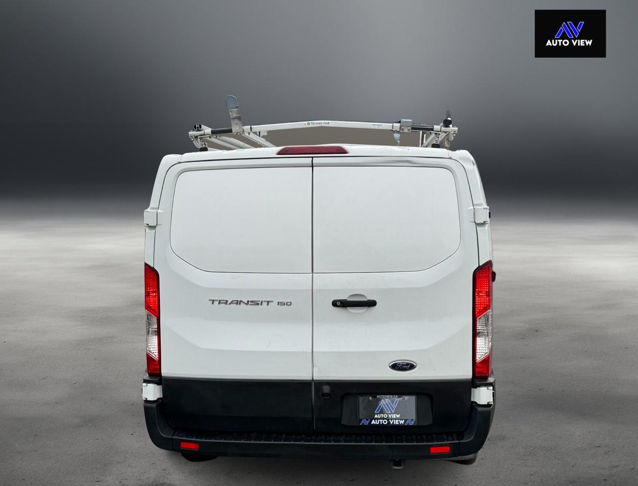 2023 Ford Transit Cargo Van T-150 130" Low Rf 8670 GVWR RWD **LADDER RACKS** Photo