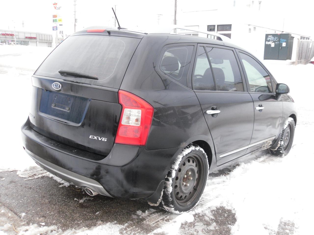 2012 Kia Rondo 4dr Wgn V6 EX w/3rd Row Photo2