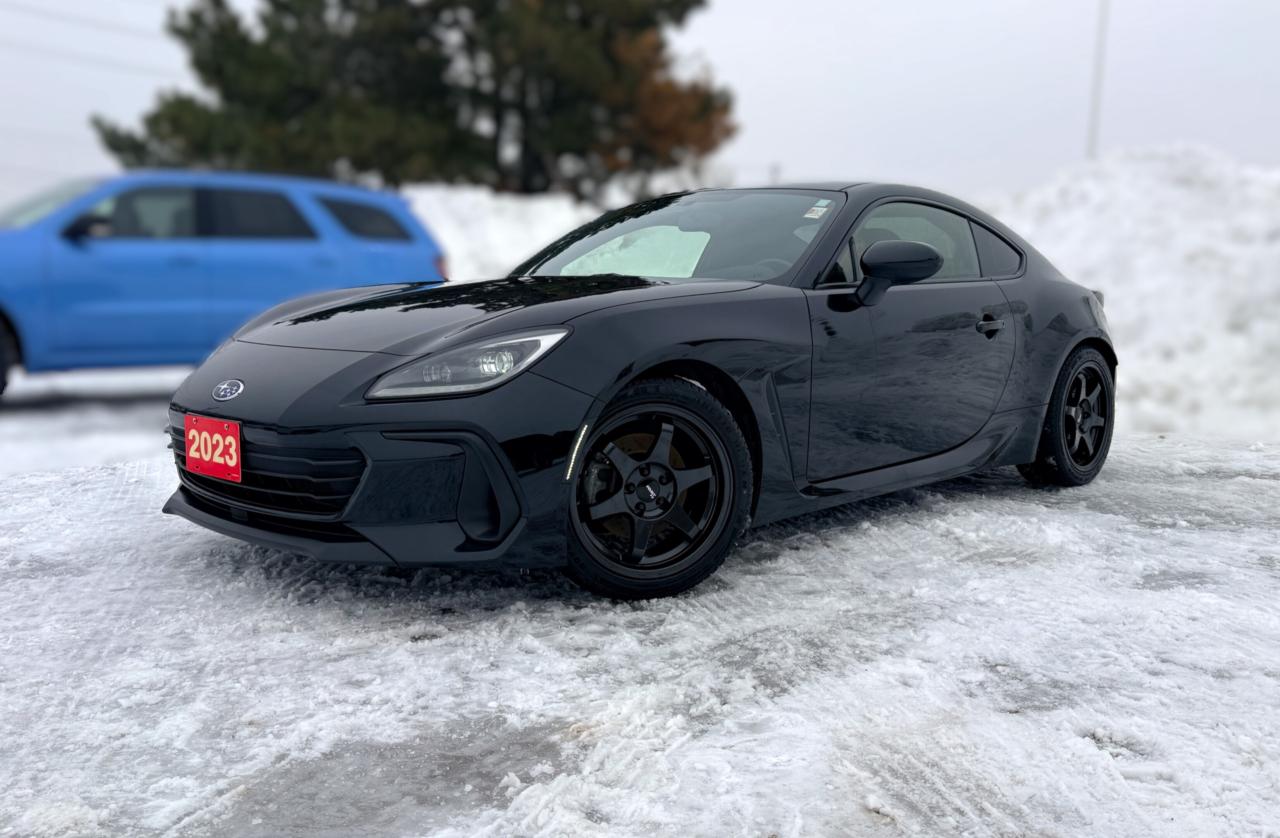 BACKUP CAMERA, BLUETOOTH,  HEATED SEATS, POWER WINDOWS AND MORE !!!

A spirited sportscar, our 2023 Subaru BRZ Sport-tech Coupe looks ready to race in Crystal Black Silica! Motivated by a 2.4 Litre BOXER 4 Cylinder providing 228hp tethered to a 6 Speed Manual transmission that encourages open-throttle driving. This Rear Wheel Drive coupe also combines a dedicated Track mode, a sport-tuned suspension, and a Torsen limited-slip differential to carve its way through the corners, and it sees approximately 8.7L/100km on the highway. Streamlined to make a striking impression, our BRZ boasts steering-responsive LED lighting, a rear spoiler, heated power mirrors, and premium alloy wheels.

Our Sport-tech cabin is for people who love driving! Its a stylish setup with heated leather/Ultrasuede front seats with red accents, a leather-wrapped steering wheel, dual-zone automatic climate control, keyless access, pushbutton ignition, and a Starlink infotainment system for easy connections with an 8-inch touchscreen, Android Auto&reg;, Apple CarPlay&reg;, Bluetooth&reg;, voice recognition, and an eight-speaker audio system. You can take advantage of versatile rear cargo space for added practicality, too!

Subaru helps raise the bar for safer travel with a rearview camera, stability/traction control, tire-pressure monitoring, ABS, advanced airbags, and other intelligent features. You can enjoy driving thrills daily with our BRZ Sport-tech! Save this Page and Call for Availability. We Know You Will Enjoy Your Test Drive Towards Ownership! 

Bustard Chrysler prides ourselves on our expansive used car inventory. We have over 100 pre-owned units in stock of all makes and models, with the largest selection of pre-owned Chrysler, Dodge, Jeep, and RAM products in the tri-cities. Our used inventory is hand-selected and we only sell the best vehicles, for a fair price. We use a market-based pricing system so that you can be confident youre getting the best deal. With over 25 years of financing experience, our team is committed to getting you approved - whether you have good credit, bad credit, or no credit! We strive to be 100% transparent, and we stand behind the products we sell. For your peace of mind, we offer a 3 day/250 km exchange as well as a 30-day limited warranty on all certified used vehicles.
