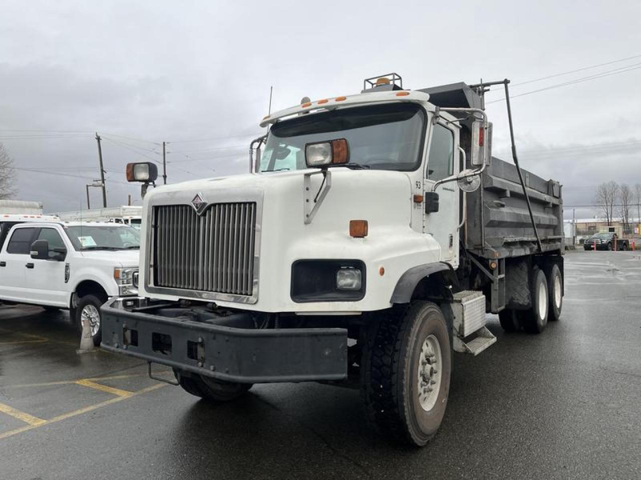 This 2003 International 5600i is a heavy-duty dump truck powered by a 12.0L inline-6 diesel engine paired with an Allison automatic transmission and a 6x4 drivetrain. It is equipped with air brakes and configured with an 18-foot dump box on a 20-foot wheelbase. Cab features include power windows, power door locks, air conditioning, and Dickey-John controls. Built as a former municipal-style vocational unit, this 5600i provides a straightforward dump configuration suited for material hauling and jobsite use.  $52,570.00 plus $375 processing fee, $52,945.00 total payment obligation before taxes.  Listing report, warranty, contract commitment cancellation fee, financing available on approved credit (some limitations and exceptions may apply). All above specifications and information is considered to be accurate but is not guaranteed and no opinion or advice is given as to whether this item should be purchased. We do not allow test drives due to theft, fraud, acts of vandalism and undetectable impaired driving. Instead we provide the following benefits: Complimentary Warranty (with options to extend), Limited Money Back Satisfaction Guarantee on Fully Completed Contracts, Contract Commitment Cancellation, and an Open-Ended Sell-Back Option. Ask seller for details or call 604-522-REPO(7376) to confirm listing availability.