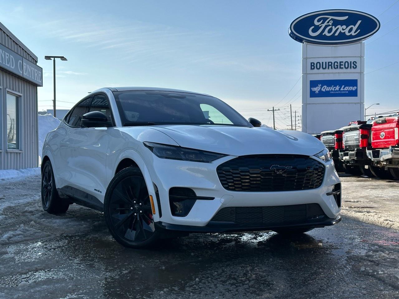 <p>The 2025 Ford Mustang Mach-E GT, finished in a pristine White, paired with an advanced AWD drivetrain, promises exhilarating all-weather capability and smooth handling. As a new edition, this SUV perfectly balances dynamic performance with cutting-edge technology.</p><p>The SUV's bold exterior features striking alloy wheels, while the spacious interior, wrapped in a sophisticated Gray, elevates your driving experience with heated front seats and a heated steering wheel for maximum comfort even in chilly conditions. Additional comforts include power seats and a Leatherette Door Trim insert, enhancing both style and enjoyment.</p><p>Packed with state-of-the-art technology, the Mach-E GT ensures a seamless drive with features like a backup camera, adaptive cruise control, and lane assist. Stay connected on the move with Bluetooth connectivity, a navigation system, and a Wi-Fi hotspot. Safety is at the forefront with brake assist, parking sensors, and a full suite of driver assistance features to ensure peace of mind on every road.</p><p>Perfect for technology-savvy individuals and families looking for style, power, and advanced features, the Mustang Mach-E GT is your perfect match. Contact us today to schedule a test drive and experience the future of driving.</p> <p><span style=color:rgb( 58 , 80 , 95 )>The discount shown on vehicle represents the </span><u>Cash Purchase</u><span style=color:rgb( 58 , 80 , 95 )> discount and is inclusive of all non-stackable and stackable cash purchase discounts from Ford of Canada and Bourgeois Motors Ltd. and is offered in lieu of sub-vented lease or finance rates. To get details on current discounts applicable to this and other vehicles in our inventory for Lease and Finance customer, see a member of our team. All offers for lease or finance are On Approved Credit (OAC).While every effort is made to ensure the accuracy of discounts and programs, programs are subject to change without notice </span><span style=color:rgb( 119 , 119 , 119 )>and may not be accurate or completely current. While every reasonable effort is made to ensure the accuracy of this data, we are not responsible for any errors or omissions contained on these pages.</span></p> <p><strong>Why Choose the Bourgeois Auto Group?</strong></p><p>For 80 years, Bourgeois Auto Group has been delivering exceptional automotive experiences. Our factor trained teams work to ensure you receive the shopping experience you deserve; whether you're looking for a new or new-to-you vehicle.</p><p>Shop 24/7 with our online showroom and chat service, ensuring convenience every step of the way. No hidden fees, full disclosure, and every pre-owned vehicle comes with a Carfax® report for peace of mind.</p><p>We offer a wide selection of pre-owned vehicles, all competitively priced using real-time market data. Get the best deal on your purchase and trade-in with our free Live Market Analysis report.</p><p>Looking to sell your car? We buy any make or modelno purchase required. Our simple to use online trade valuation tool will provide you with a clear, transparent selling experience whether you buy our car or not.</p><p>Backed by hundreds dedicated employees across 4 convenient locations, were here to meet all your automotive needs. Visit us in Midland or Parry Sound and explore our inventory or schedule your next service today.</p> <p><strong>Financing Your Next Vehicle with Bourgeois Motors Ford in Midland:</strong></p><p>At Bourgeois Motors Ford, we make financing your next vehicle simple and stress-free! Our team works with trusted lenders to find flexible options tailored to your budget. Drive away with confidenceapply today!</p><p>Take advantage of our online pre-qualification tool, backed by Equifax and TD Bank to find the payment that works for you. Simply <a href=https://www.bourgeoismotors.com/free-credit-check/ rel=nofollow><strong>CLICK HERE</strong></a><strong> </strong>to use our secure online credit tool with no impact to your credit.</p>