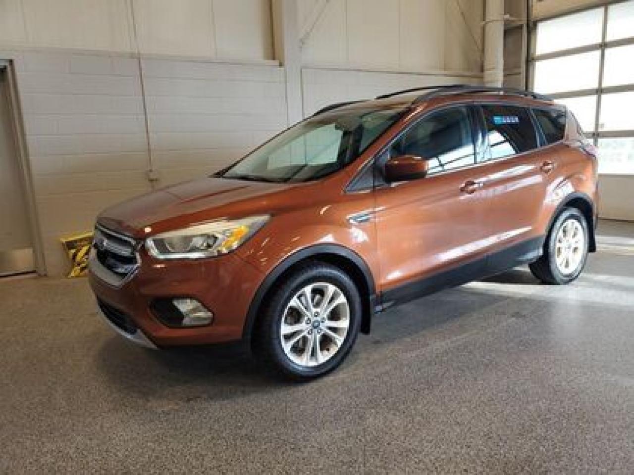 **HOT TRADE ALERT!!** Locally owned 2017 Ford Escape SE 4WD. This one owner SUV comes with the ever popular 2.0L EcoBoost GTDI I-4 engine that produces a remarkable 245 Horsepower and 275 lb-ft of torque and a 6-speed automatic transmission.

Key Features:
4X4
Cloth Seats
Power Driver Seat
Bluetooth
SYNC
Cruise Control
Back Up Camera
Back Up Sensors
Keyless Entry
Auto Start Stop
Key Pad Entry
Power Moonroof
Climate Control

After this vehicle came in on trade, we had our fully certified Pre-Owned Ford mechanic perform a mechanical inspection. This vehicle passed the certification with flying colors. After the mechanical inspection and work was finished, we did a complete detail including sterilization and carpet shampoo. 

Moose Jaw Ford, conveniently located at 1010 North Service Road in Moose Jaw, is your trusted destination for all your automotive needs. With an impressive 4.8-star Google rating from nearly 1,500 reviews, we are proud to deliver an exceptional vehicle-buying experience tailored just for you. Our Moose Jaw Motives set us apart, offering unbeatable value like half-priced oil changes for life on pre-owned vehicles, one year of key and remote protection, and one year of tire and rim protection. Enjoy peace of mind with every purchase. At Moose Jaw Ford, were committed to driving positive change in our community by combining exceptional service, high-quality vehicles, and a guest-first approach. Visit us today!