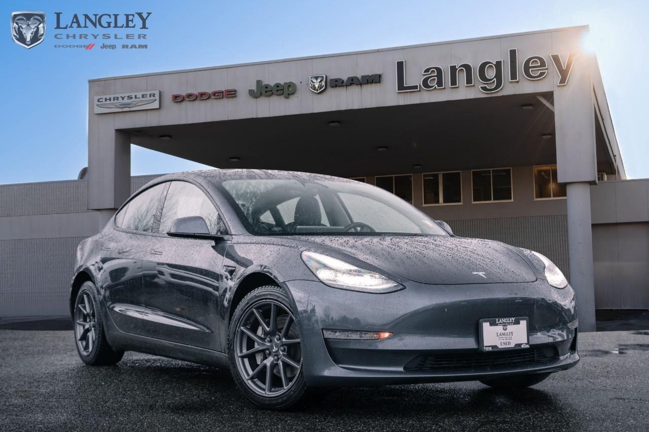 <p><strong>2022 Tesla Model 3 Rear-Wheel Drive (Standard Range)</strong> In 2022, Tesla rebranded the "Standard Range Plus" simply as the Model 3 Rear-Wheel Drive. This version transitioned to a Lithium Iron Phosphate (LFP) battery, which allows owners to regularly charge to 100% without the typical degradation concerns of other chemistries. </p><p></p><ul><li><p><strong>Drivetrain:</strong> Rear-Wheel Drive (RWD) </p><p></p></li><li><p><strong>Horsepower:</strong> 283 hp </p><p></p></li><li><p><strong>Torque:</strong> 302 lb-ft (estimated) </p><p></p></li><li><p><strong>0100 km/h:</strong> 6.1 seconds </p><p></p></li><li><p><strong>Estimated Range:</strong> 438 km (EPA est.) </p><p></p></li><li><p><strong>Standard Features:</strong> 15-inch central touchscreen, tinted glass roof, heated front and rear seats, heated steering wheel, and Autopilot (includes Traffic-Aware Cruise Control and Autosteer). </p><p></p></li><li><p><strong>Storage:</strong> 649 L (combined front and rear trunks) </p><p></p></li></ul><p>Come book a test drive at Langley Chrysler, conveniently located in Langley, British Columbia.</p>

<p>*All prices plus applicable taxes, applicable environmental recovery charges, documentation of $599 and full tank of fuel surcharge of $76 if a full tank is chosen. <br />Other protection items available that are not included in the above price:<br />Tire & Rim Protection and Key fob insurance starting from $599<br />Service contracts (extended warranties) for coverage up to 7 years and 200,000 kms starting from $599<br />Custom vehicle accessory packages, mudflaps and deflectors, tire and rim packages, lift kits, exhaust kits and tonneau covers, canopies and much more that can be added to your payment at time of purchase<br />Undercoating, rust modules, and full protection packages starting from $199<br />Financing Fee of $500 when applicable<br />Flexible life, disability and critical illness insurances to protect portions of or the entire length of vehicle loan</p>