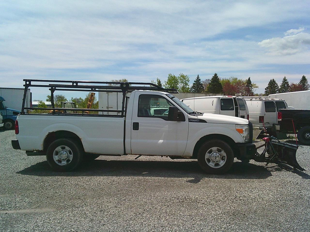 2012 Ford F-250 2WD Reg Cab 137 XL Snow Plow Photo