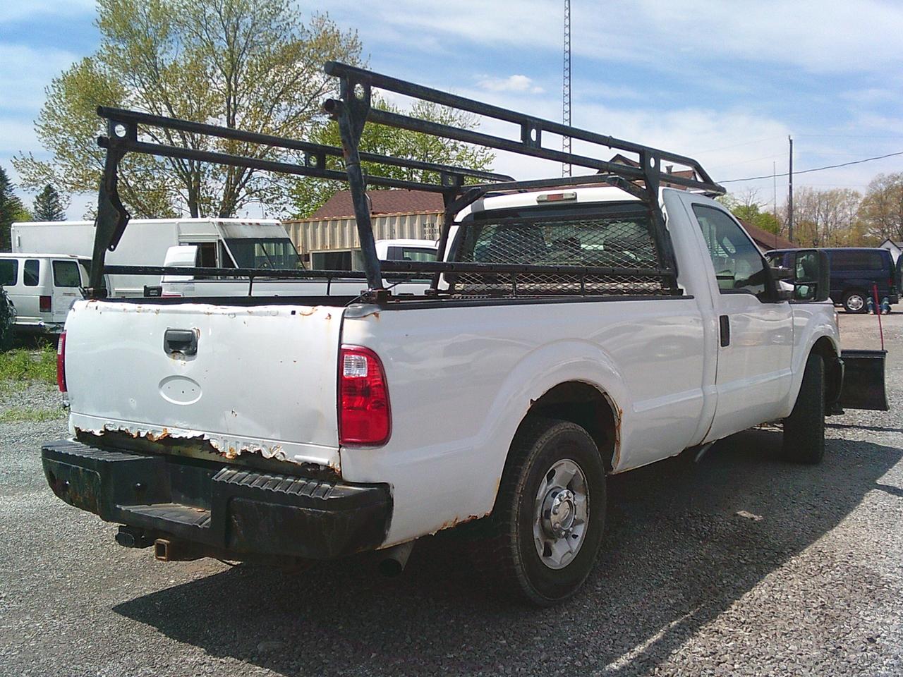 2012 Ford F-250 2WD Reg Cab 137 XL Snow Plow Photo