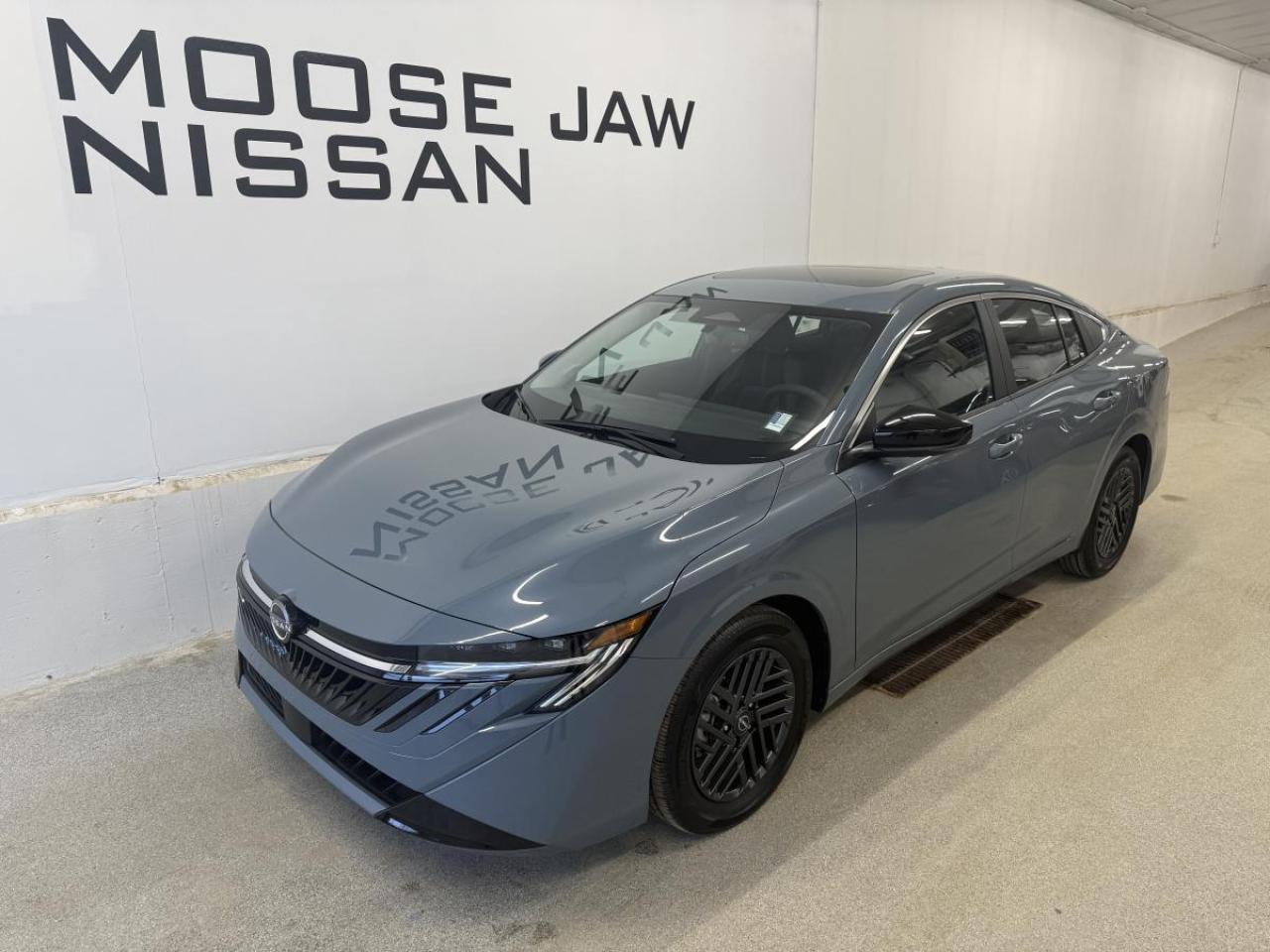 Experience the future of driving with the brand new 2026 Nissan Sentra SV, now available at Moose Jaw Nissan. This sedan stands out with its Atlantic Grey Pearl exterior and sleek black interior, offering a modern and refined presence. Equipped with a 2.0L DOHC 16-valve 4-cylinder engine and Xtronic Continuously Variable Transmission, it delivers a smooth and efficient drive every time. The Sentra SV is engineered for comfort, convenience, and advanced safety, making it the ideal choice for drivers seeking reliability and style in Moose Jaw.

ADVANCED SAFETY FEATURES  
»» Backup camera for safer parking  
»» Side impact airbags for added protection  
»» Traction control for stable handling  
»» Anti-lock braking system for secure stops  

PERFORMANCE AND EFFICIENCY  
»» 2.0L DOHC 16V 4-cylinder engine  
»» Xtronic Continuously Variable Transmission  
»» Front-wheel drive for confident traction  
»» Remote engine start for convenience  

COMFORT AND CONVENIENCE  
»» Spacious seating for five passengers  
»» Air conditioning for year-round comfort  
»» Power windows for effortless control  
»» Keyless entry for easy access  

TECHNOLOGY AND CONNECTIVITY  
»» Bluetooth hands-free phone system  
»» USB port for device charging  
»» Touchscreen display for easy navigation  
»» Steering wheel audio controls  

CARGO SPACE  
»» Large trunk for daily essentials  
»» Split-folding rear seats for flexibility  
»» Wide opening for easy loading  
»» Ample storage for travel needs  

WHAT OTHER OWNERS LIKE  
»» Smooth and quiet ride quality  
»» User-friendly infotainment system  
»» Excellent fuel efficiency  
»» Comfortable and spacious interior  

This 2026 Nissan Sentra SVs VIN is: 3N1AB9CV8TY209543.