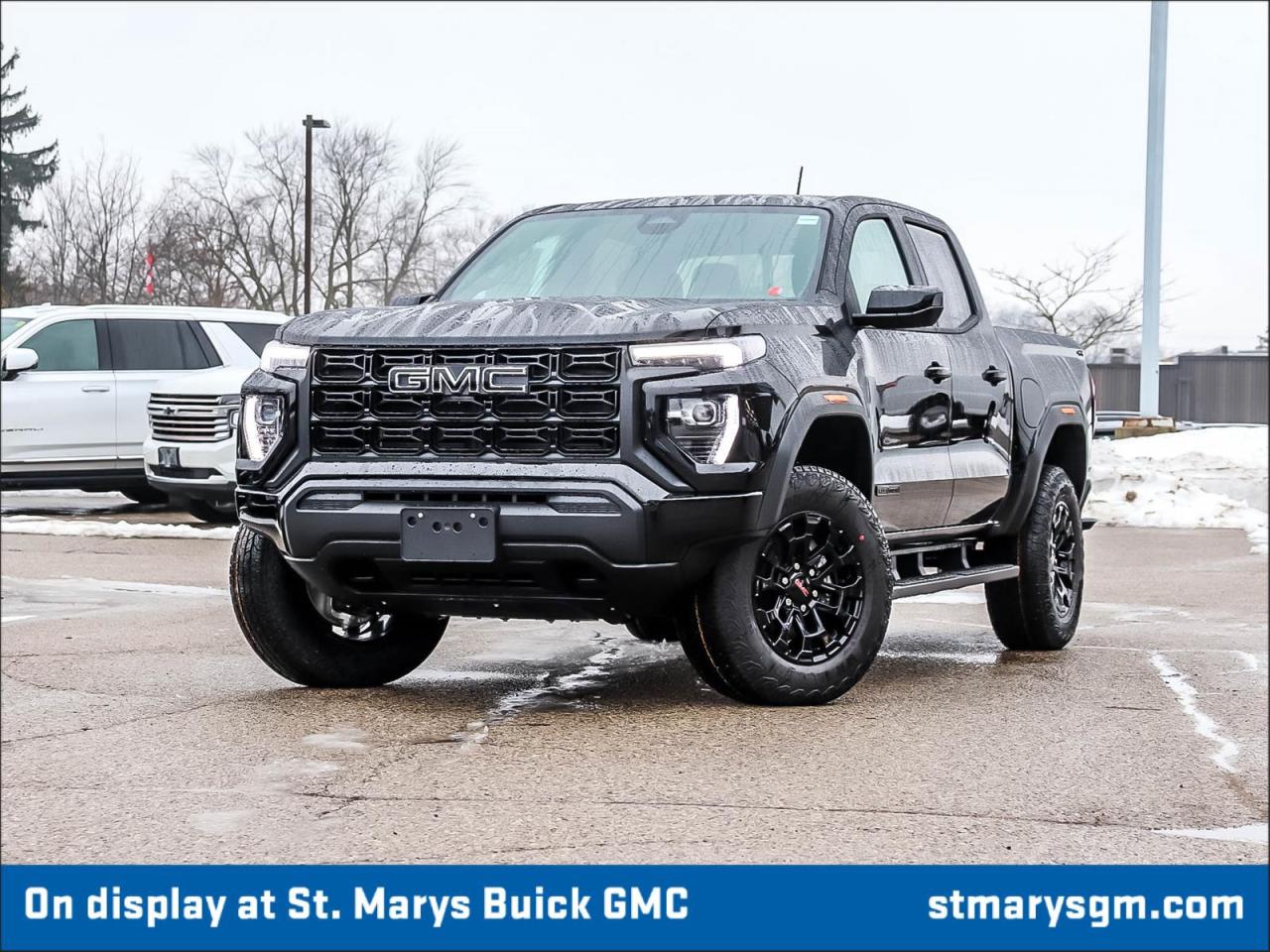 <h1>2026 GMC Canyon Elevation Crew Cab 4WD</h1><p>The 2026 GMC Canyon Elevation Crew Cab 4WD is designed for those who crave adventure and reliability. With its robust features, stunning design, and powerful performance, this vehicle stands out in the midsize pickup segment.</p><h2>Key Features</h2><ul><li><strong>2.7L Turbomax Engine:</strong> Delivers an impressive balance of power and efficiency.</li><li><strong>All-Wheel Drive:</strong> Ensures superior traction and control on various terrains.</li><li><strong>Elevation Edition Styling:</strong> Features a bold front grille and blacked-out accents for a sleek look.</li><li><strong>Spacious Crew Cab:</strong> Provides ample room for passengers and cargo alike.</li><li><strong>Advanced Infotainment System:</strong> Includes a responsive touchscreen, smartphone integration and premium sound system.</li><li><strong>Safety Features:</strong> Equipped with advanced safety technologies such as lane departure warning and forward collision alert.</li><li><strong>Towing Capacity:</strong> Capable of towing your gear with confidence thanks to its powerful engine and robust build.</li><li><strong>Onyx Black Exterior:</strong> A striking finish that adds to the vehicle's rugged elegance.</li></ul><h2>Design</h2><p>The Canyon Elevation&rsquo;s exterior is accentuated by its Onyx Black finish, which creates a bold and sophisticated look. The truck&rsquo;s muscular stance is enhanced by its wide wheel arches and aggressive front fascia. The 20-inch wheels complement the overall aesthetics, while the bed is designed for practical utility without compromising style.</p><h2>Performance</h2><p>Under the hood, the 2.7L Turbomax engine is a powerhouse that generates substantial horsepower and torque, making it an exceptional choice for both daily commuting and off-road adventures. The precise engineering allows for a smooth and responsive driving experience, while the all-wheel-drive system enhances handling in challenging weather conditions.</p><h2>Interior Comfort</h2><p>Step inside the Canyon Elevation, and you&rsquo;ll find a spacious cabin equipped with premium materials and modern conveniences. With comfortable seating for up to five passengers, it&rsquo;s perfect for both work and play. The intuitive infotainment system keeps you connected on the go, and the ample storage compartments ensure that you can carry all your essentials effortlessly.</p><h2>Conclusion</h2><p>The 2026 GMC Canyon Elevation Crew Cab 4WD is not just a vehicle; it is a reliable partner for those who champion exploration and adventure. With its stellar performance, advanced features, and striking design, it is ready to tackle any journey you choose to take.</p>