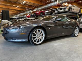 This DB9 Coupe is originally from the USA and was imported to BC in 2007. Well equipped with Heated power front leather seats, Navigation, Linn premium 260 Watt audio system, 6 Disc CD changer, Tilt / telescopic steering wheel, Paddle shifters, Power windows, Power door locks, Power folding mirrors, Cruise control, Keyless entry, Push button ignition, Wood trim, Alcantara headliner, Xenon headlamps, Headlamp washing system, 19 Alloy wheels. 5.9L V12 mated to a 6 speed shiftable automatic transmission rated by the factory at 450hp / 420lb-ft. A 1 year warranty is included in the purchase price of this vehicle. Well maintained and just serviced. Leasing and financing available. All trades accepted. 
 Viewing by appointment 
 Dealer # 10290 null