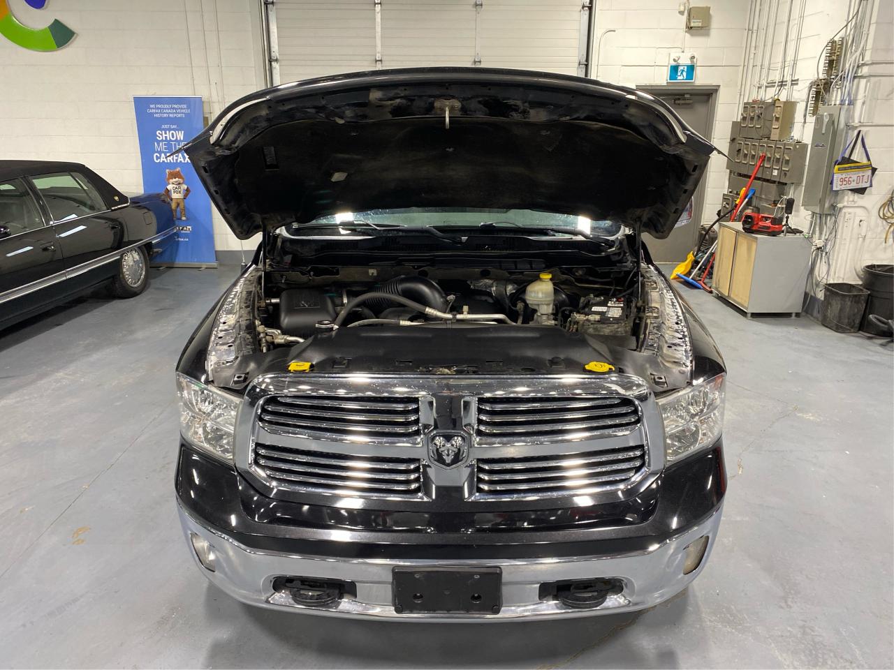 2015 RAM 1500 4WD QUAD CAB 140.5" BIG HORN 5.7L HEMI Photo