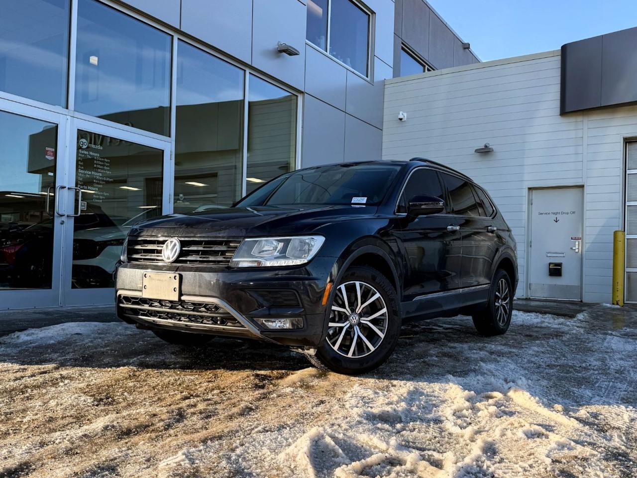 Discover the perfect blend of style, performance, and versatility with this pre-owned 2018 Volkswagen Tiguan Comfortline 4MOTION in sleek Black. Powered by a peppy 2.0L TSI 184HP engine paired with an 8-speed automatic transmission, it delivers confident handling with full-time all-wheel drive. Enjoy heated front comfort seats wrapped in quality leatherette, a modern 8-inch touchscreen with Bluetooth and SiriusXM, plus advanced safety features including blind spot warning and rear backup camera. With spacious cargo space, dual-zone climate control, and premium 17 alloy wheels, this Tiguan is ready for every journey. Experience German engineering and comfortschedule your test drive today!Vehicle was previously registered in Ontario and New BrunswickVehicle has a Claim on the Carfax history reportGo Mazda is a AMVIC licenced buisness